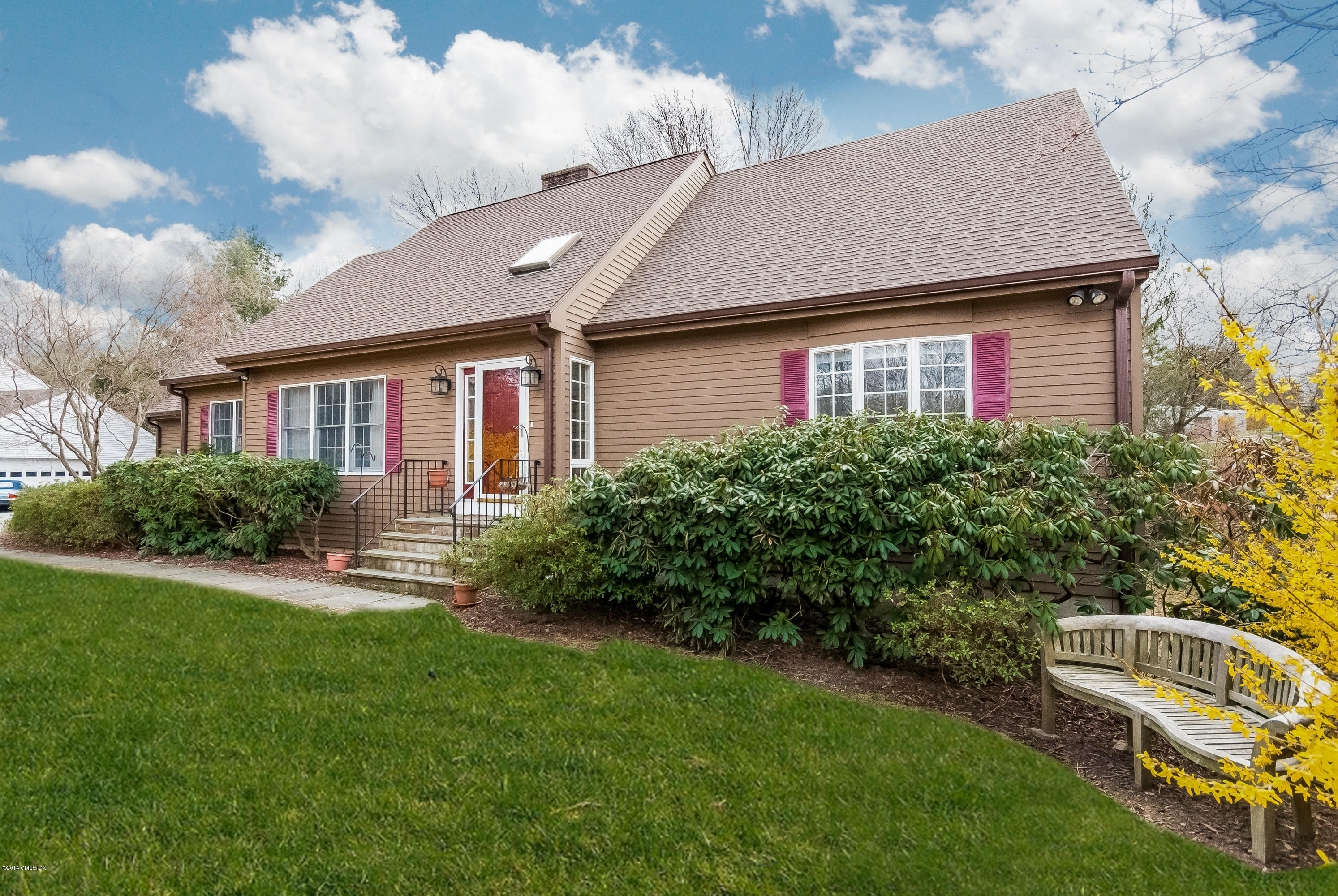 a front view of a house with garden