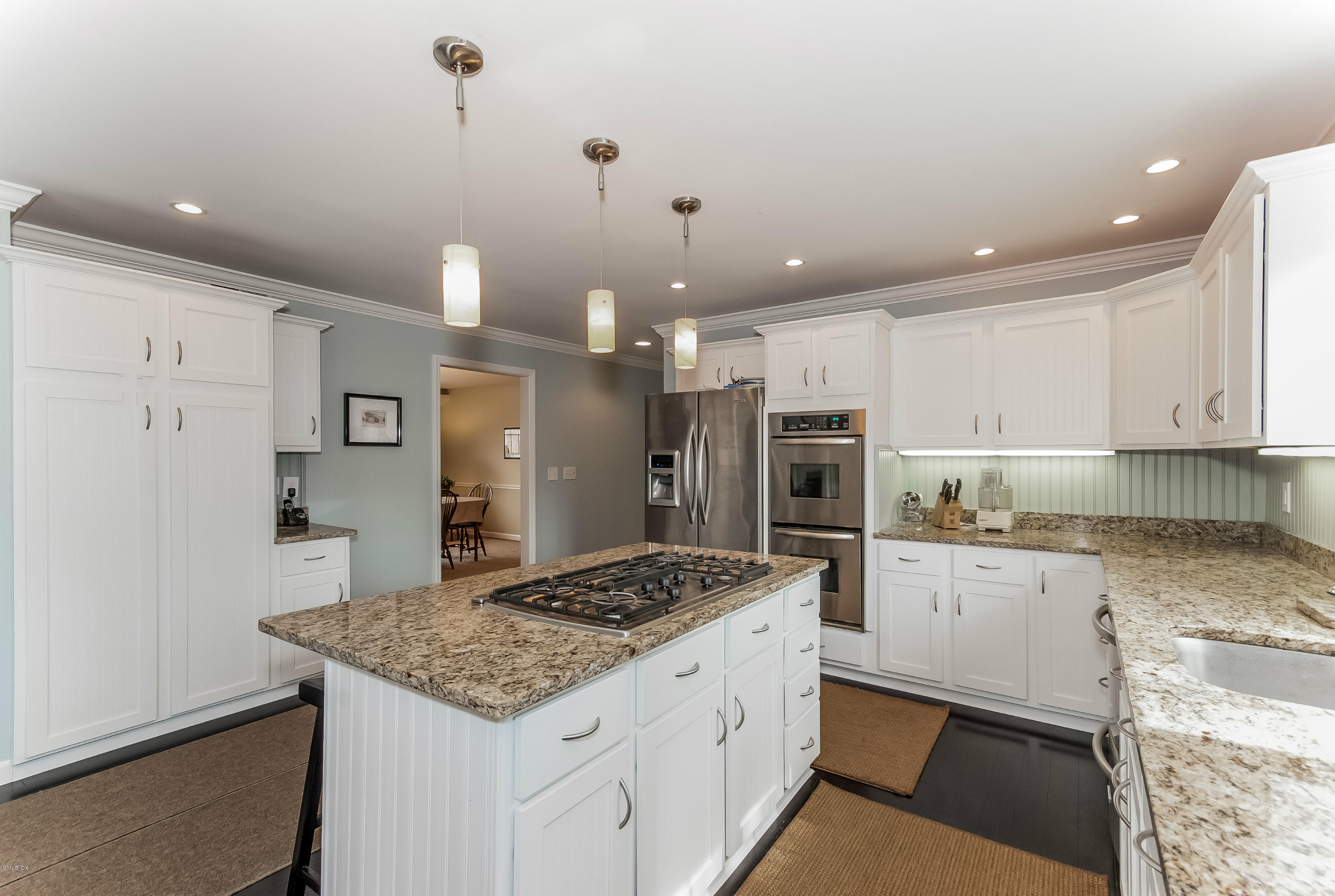 21 Roberta Lane Greenwich, CT 06830 - Photo 12 of 39 a kitchen with kitchen island a refrigerator a stove a sink and a oven