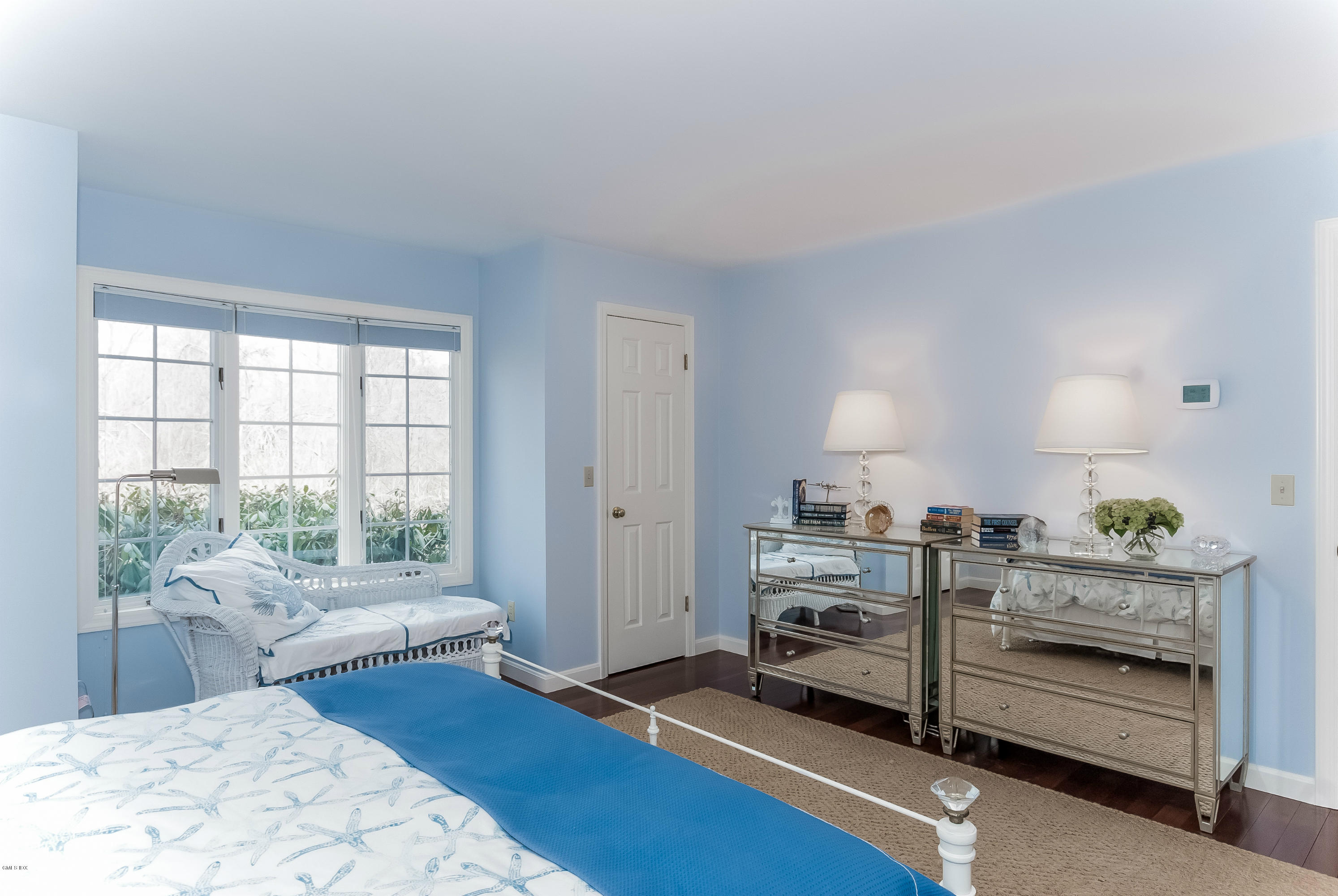 21 Roberta Lane Greenwich, CT 06830 - Photo 19 of 39 a bedroom with furniture and a wooden floor