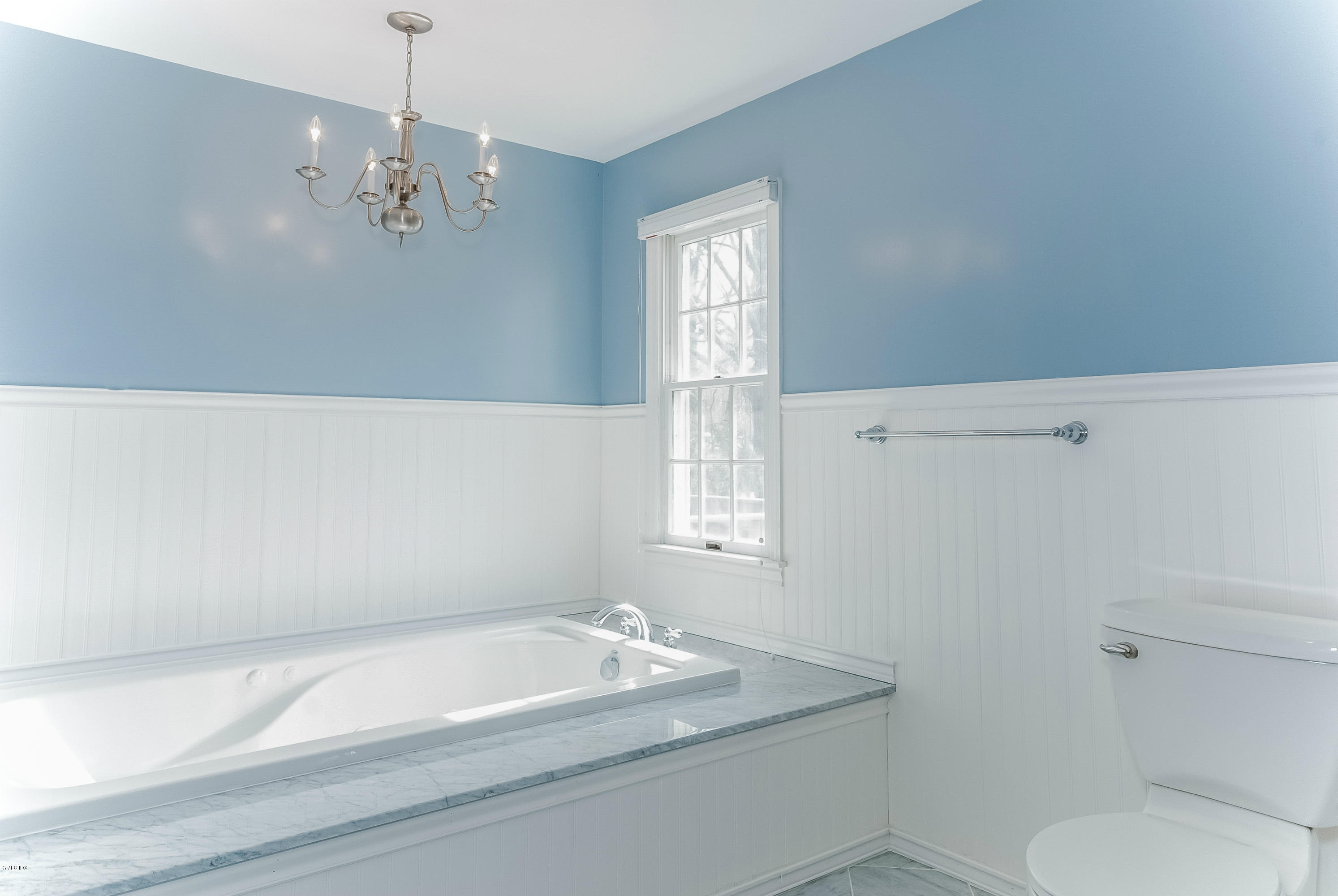 21 Roberta Lane Greenwich, CT 06830 - Photo 21 of 39 a bathroom with a granite countertop bathtub sink vanity mirror and toilet