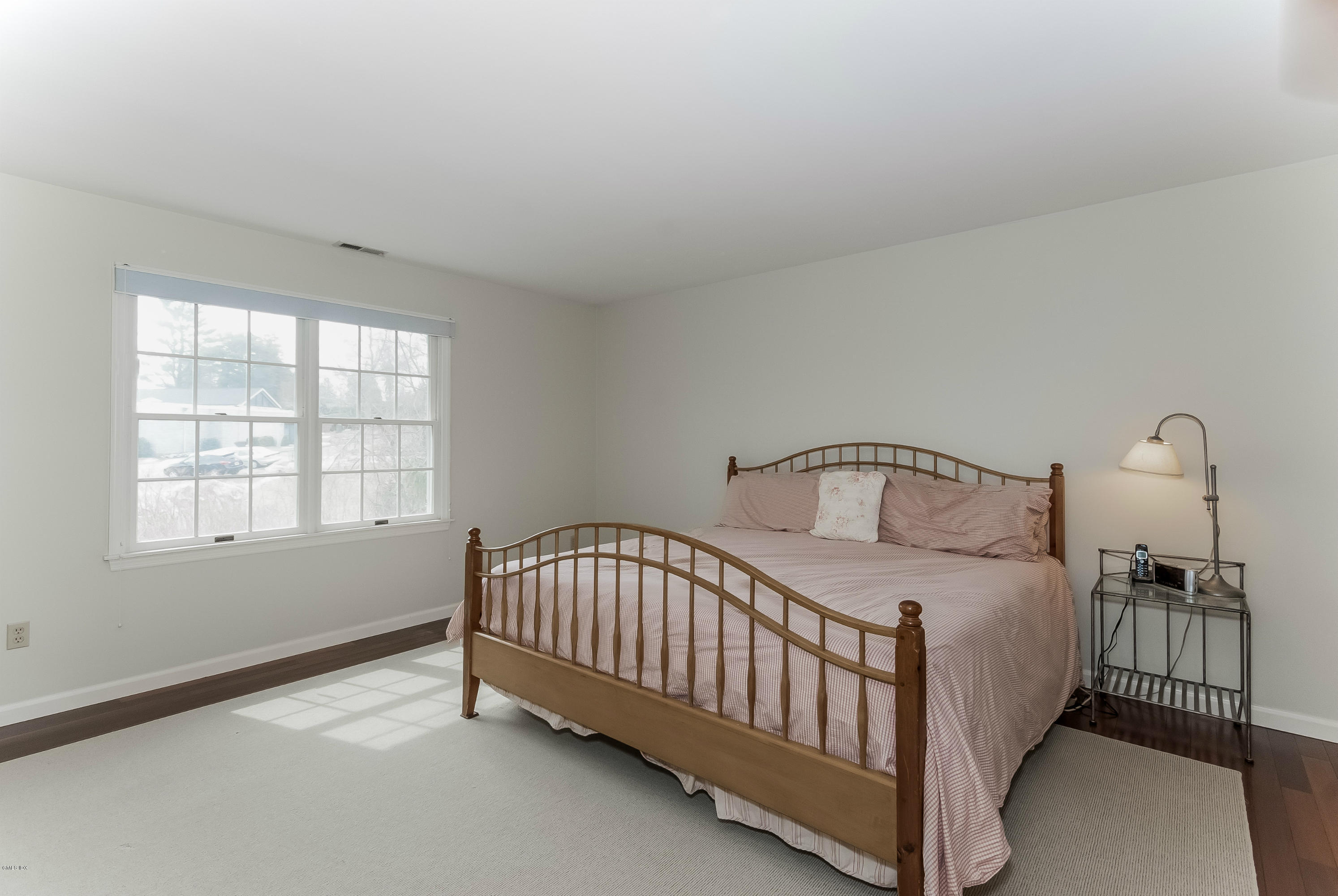 21 Roberta Lane Greenwich, CT 06830 - Photo 22 of 39 a bedroom with a bed and a window