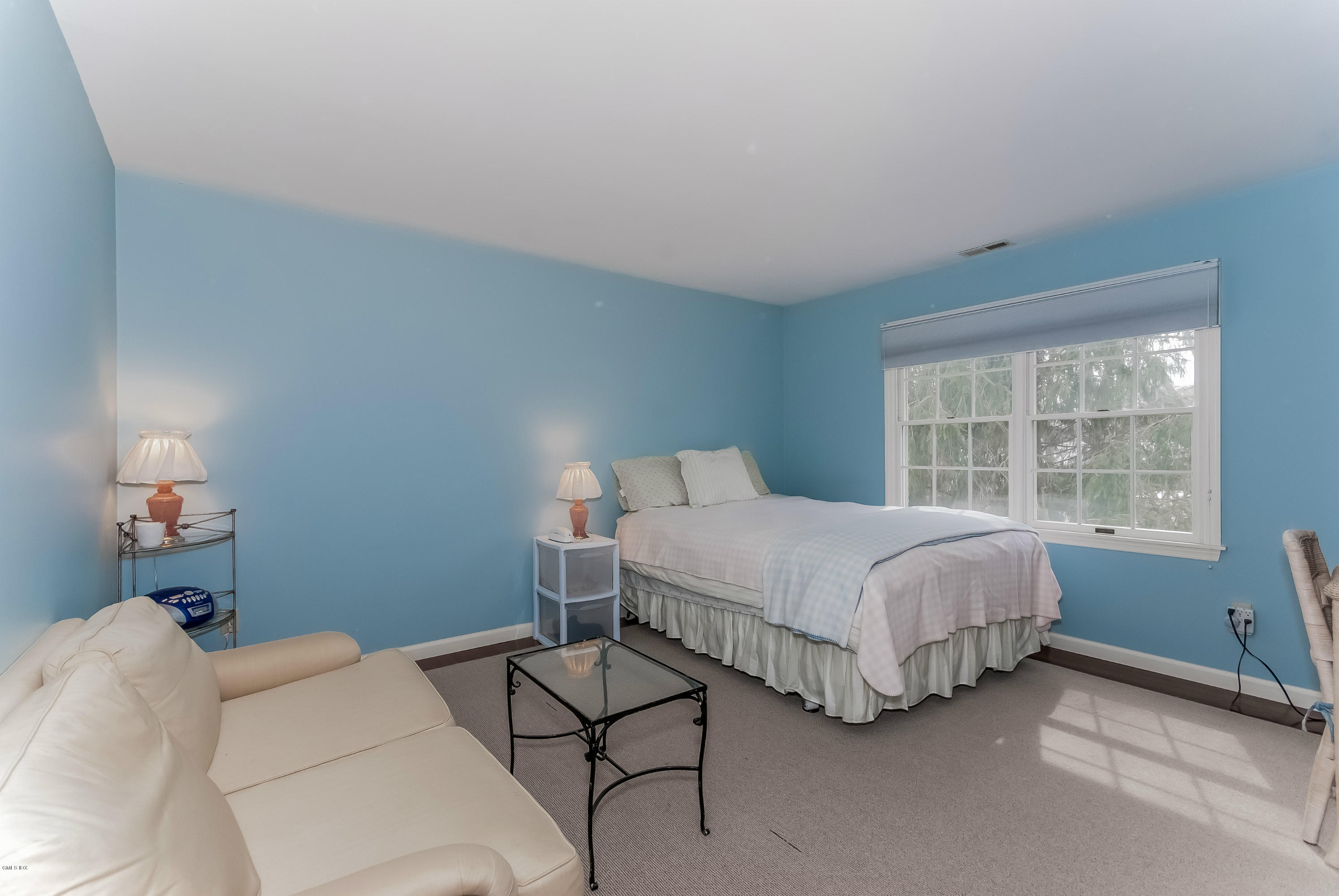 21 Roberta Lane Greenwich, CT 06830 - Photo 24 of 39 a bedroom with a bed and a window