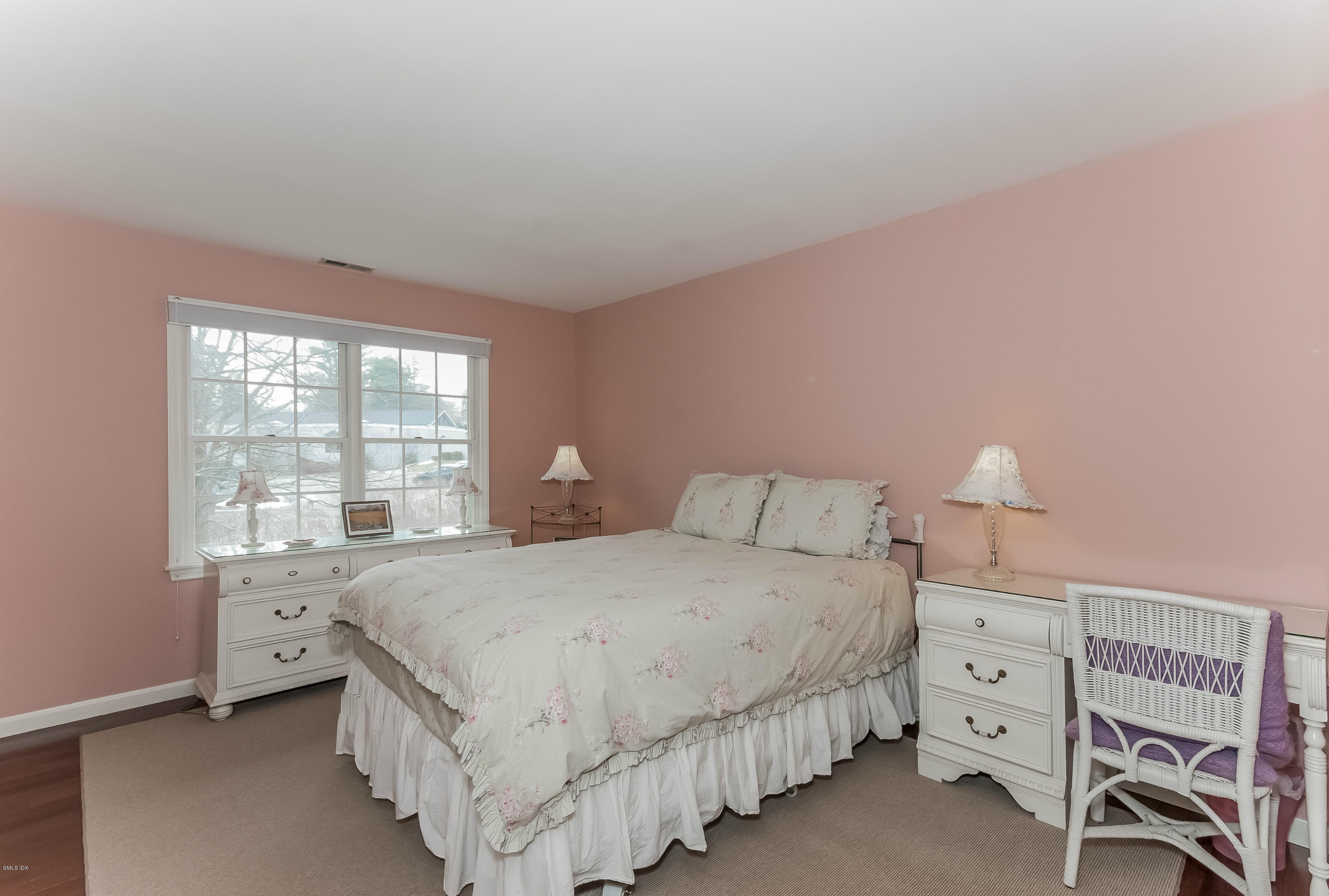 21 Roberta Lane Greenwich, CT 06830 - Photo 25 of 39 a bedroom with a bed and a window