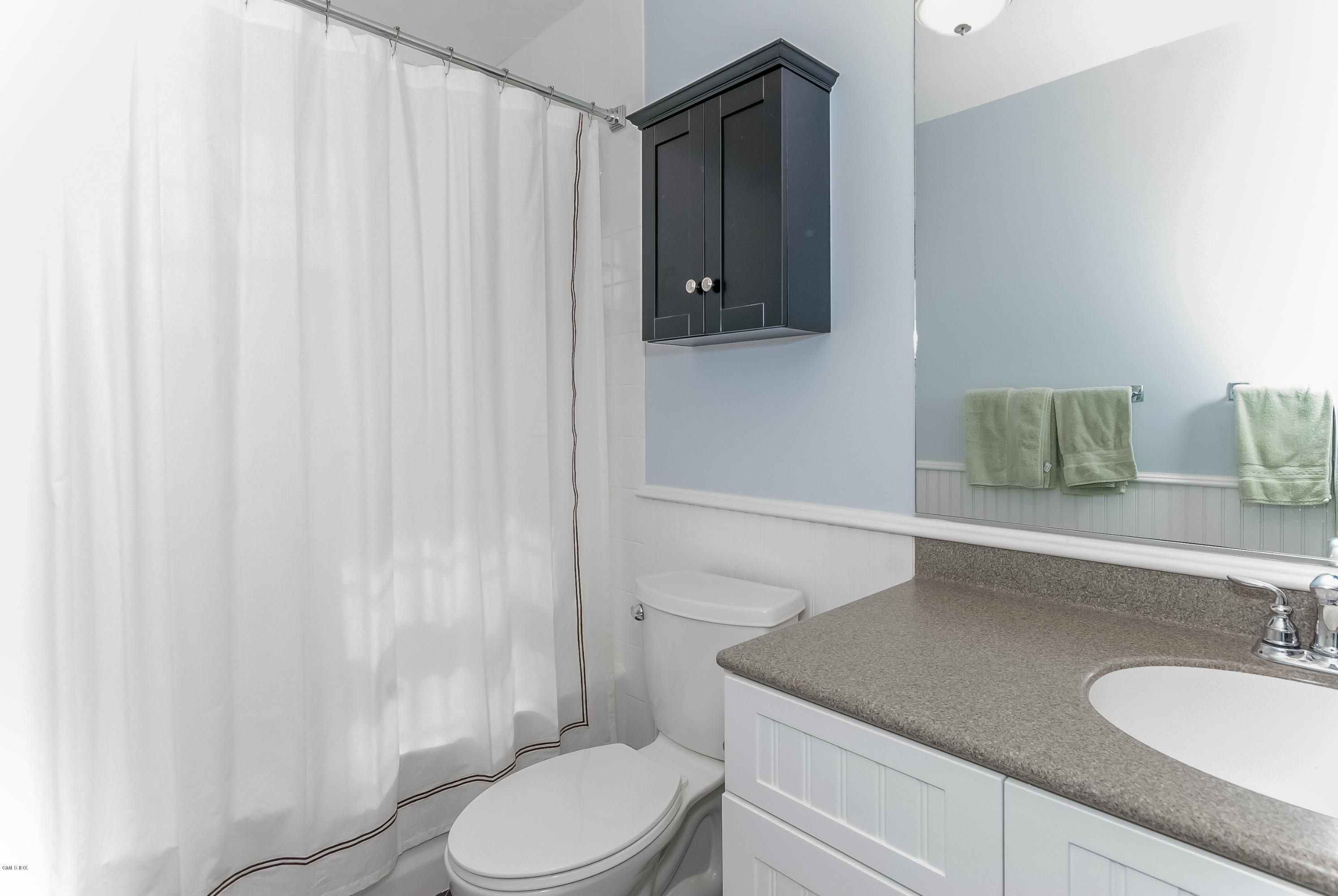 21 Roberta Lane Greenwich, CT 06830 - Photo 26 of 39 a bathroom with a granite countertop sink and a mirror