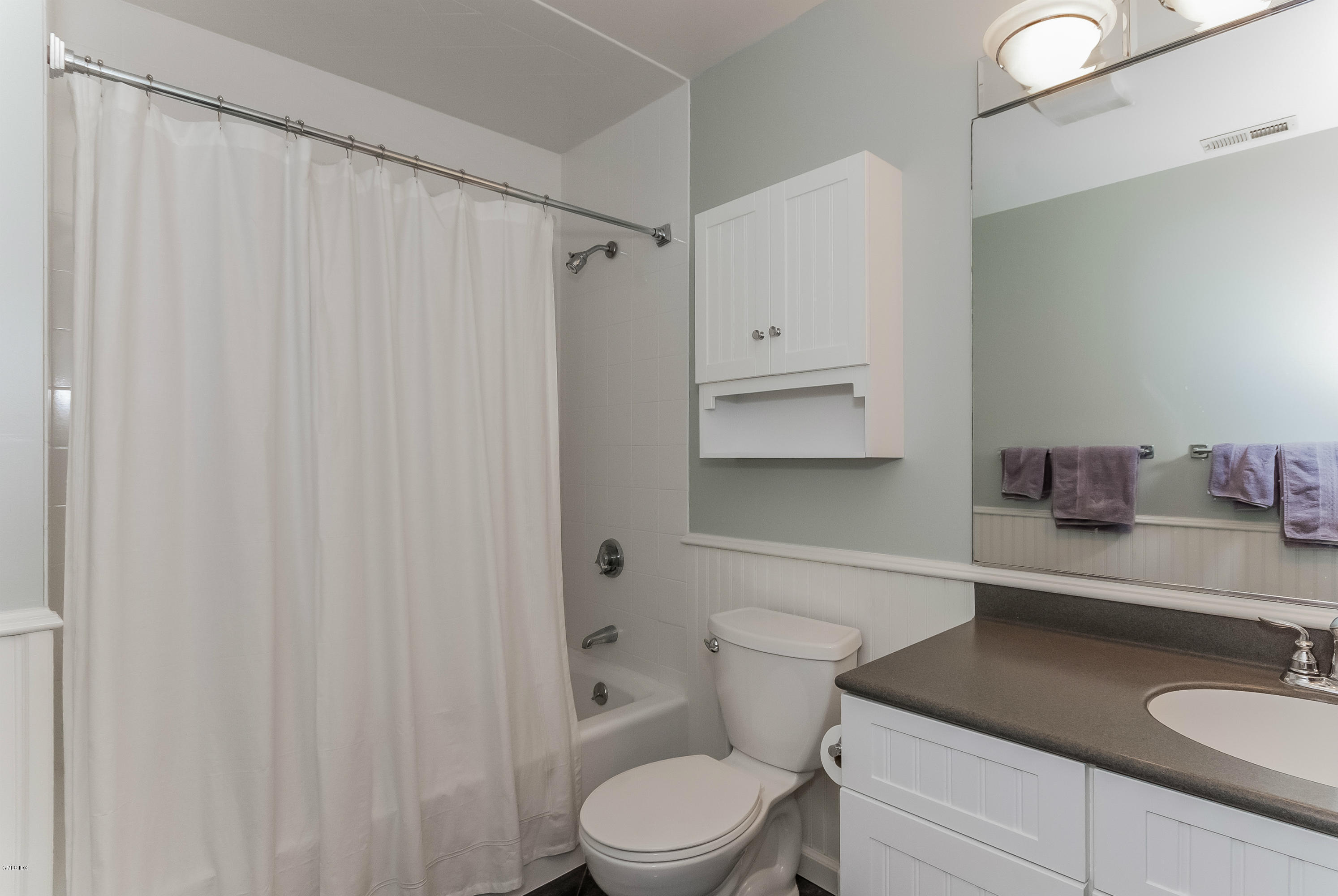 21 Roberta Lane Greenwich, CT 06830 - Photo 29 of 39 a bathroom with a granite countertop sink vanity mirror and toilet