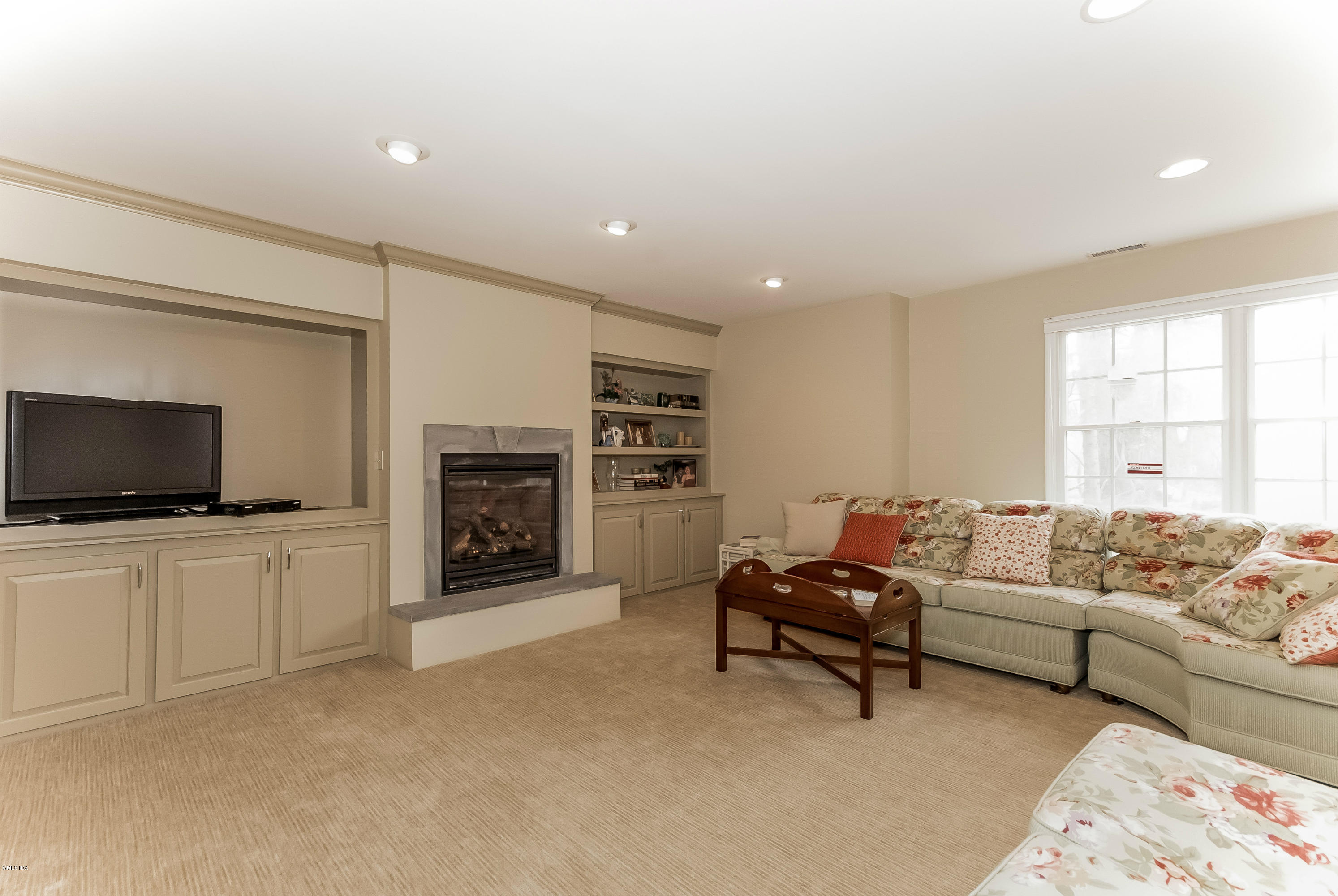 21 Roberta Lane Greenwich, CT 06830 - Photo 30 of 39 a living room with furniture and a flat screen tv
