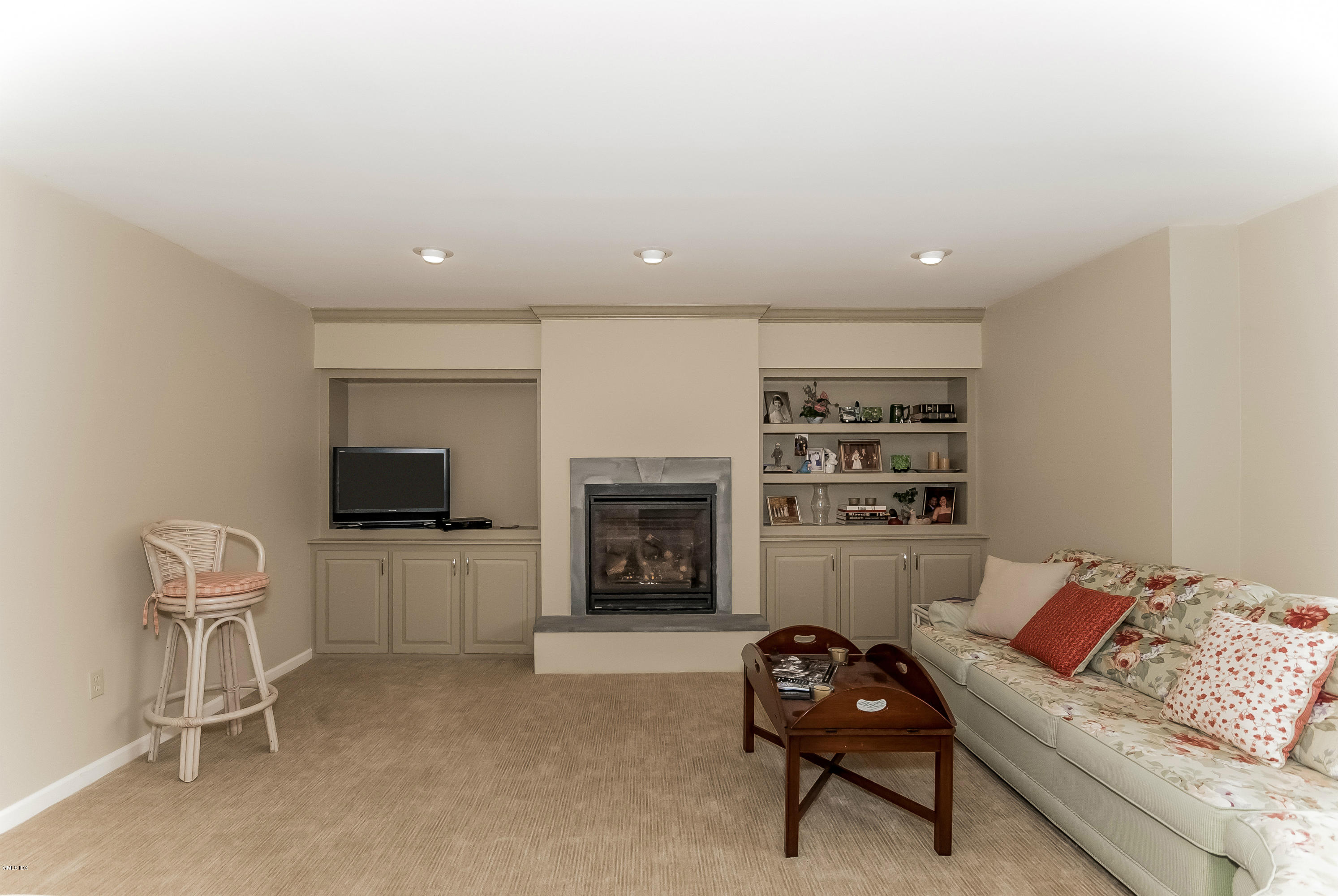 21 Roberta Lane Greenwich, CT 06830 - Photo 31 of 39 a living room with furniture a fireplace