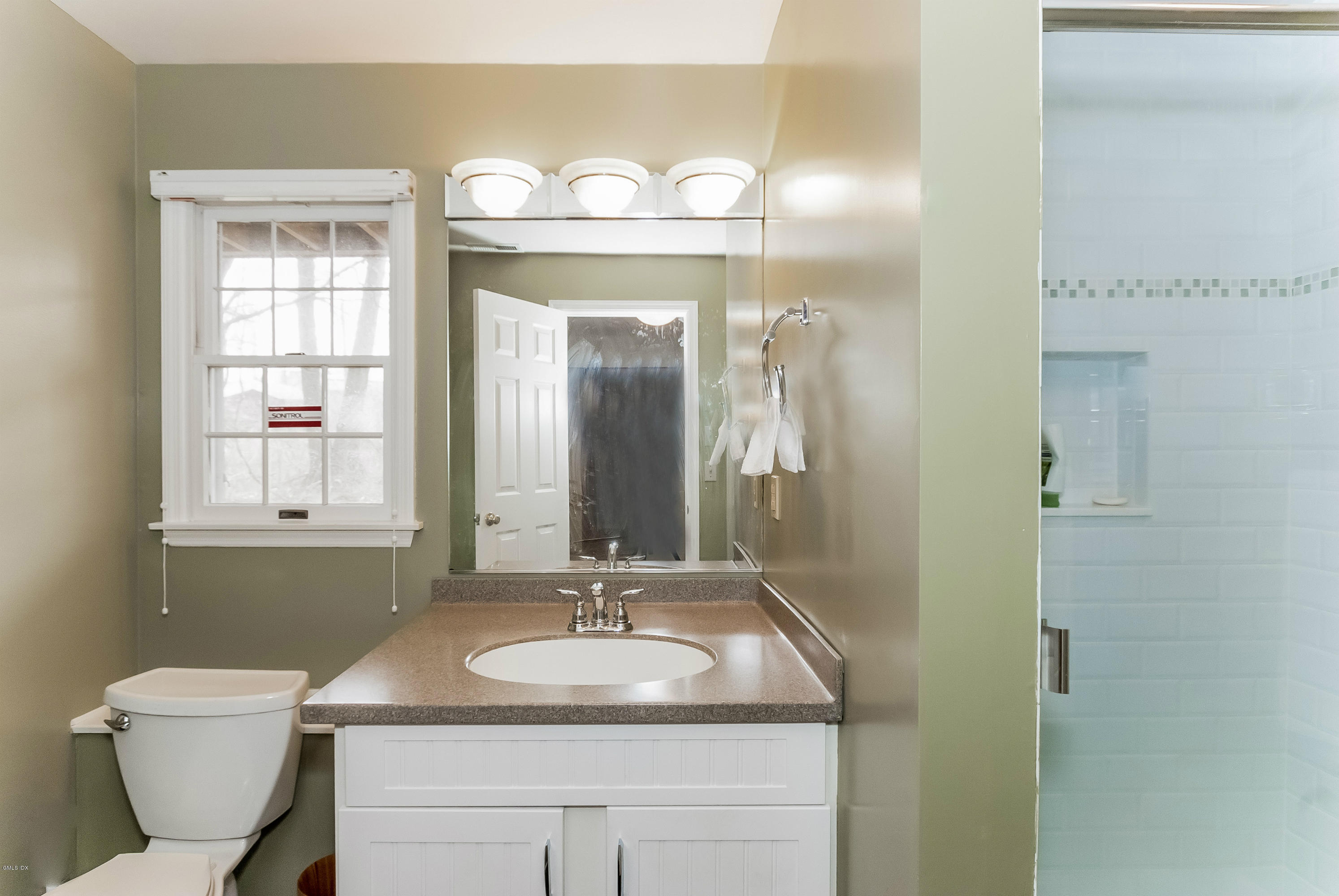 21 Roberta Lane Greenwich, CT 06830 - Photo 33 of 39 a bathroom with a toilet sink and mirror