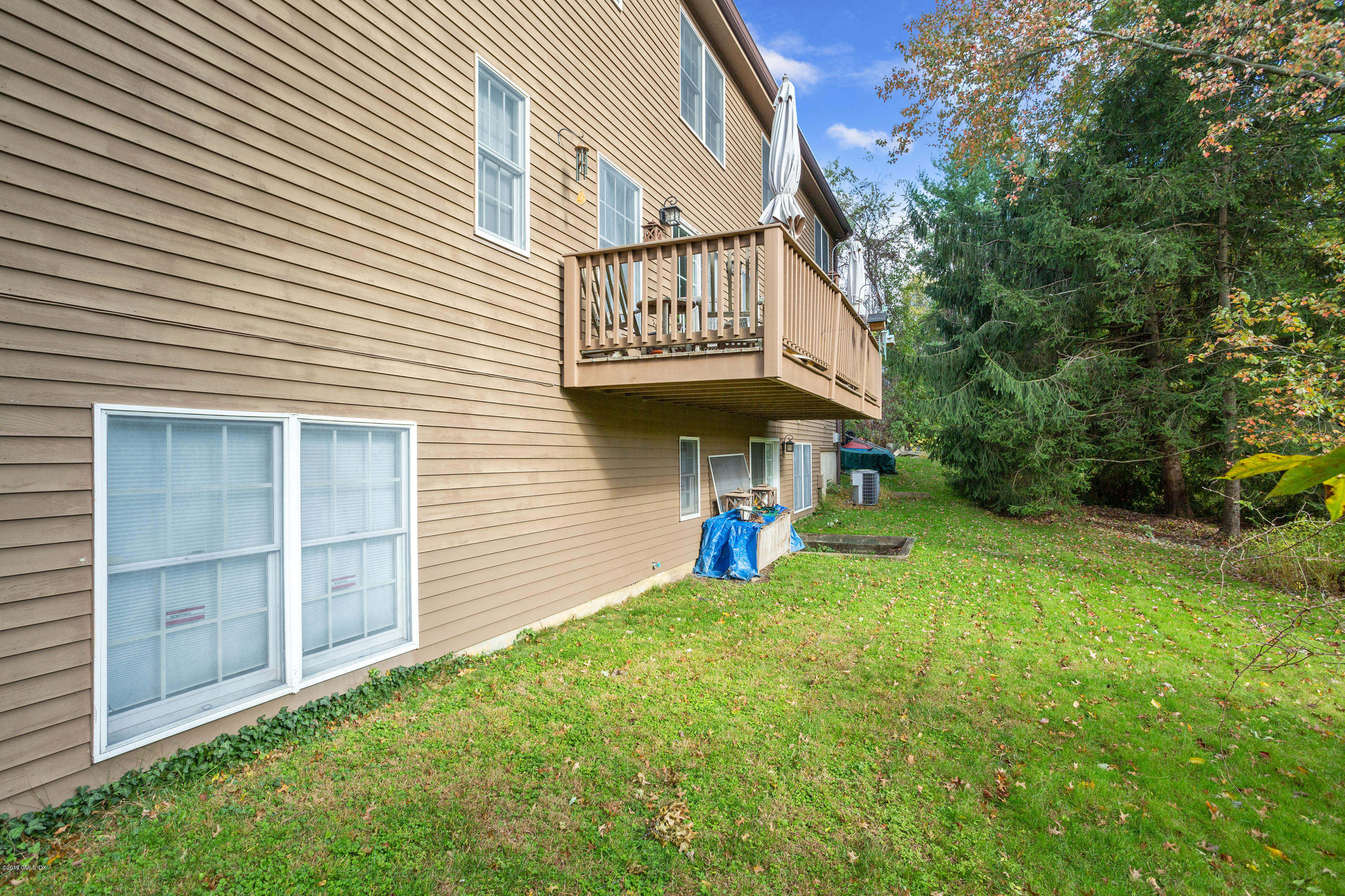 21 Roberta Lane Greenwich, CT 06830 - Photo 38 of 39 a view of a porch with a yard