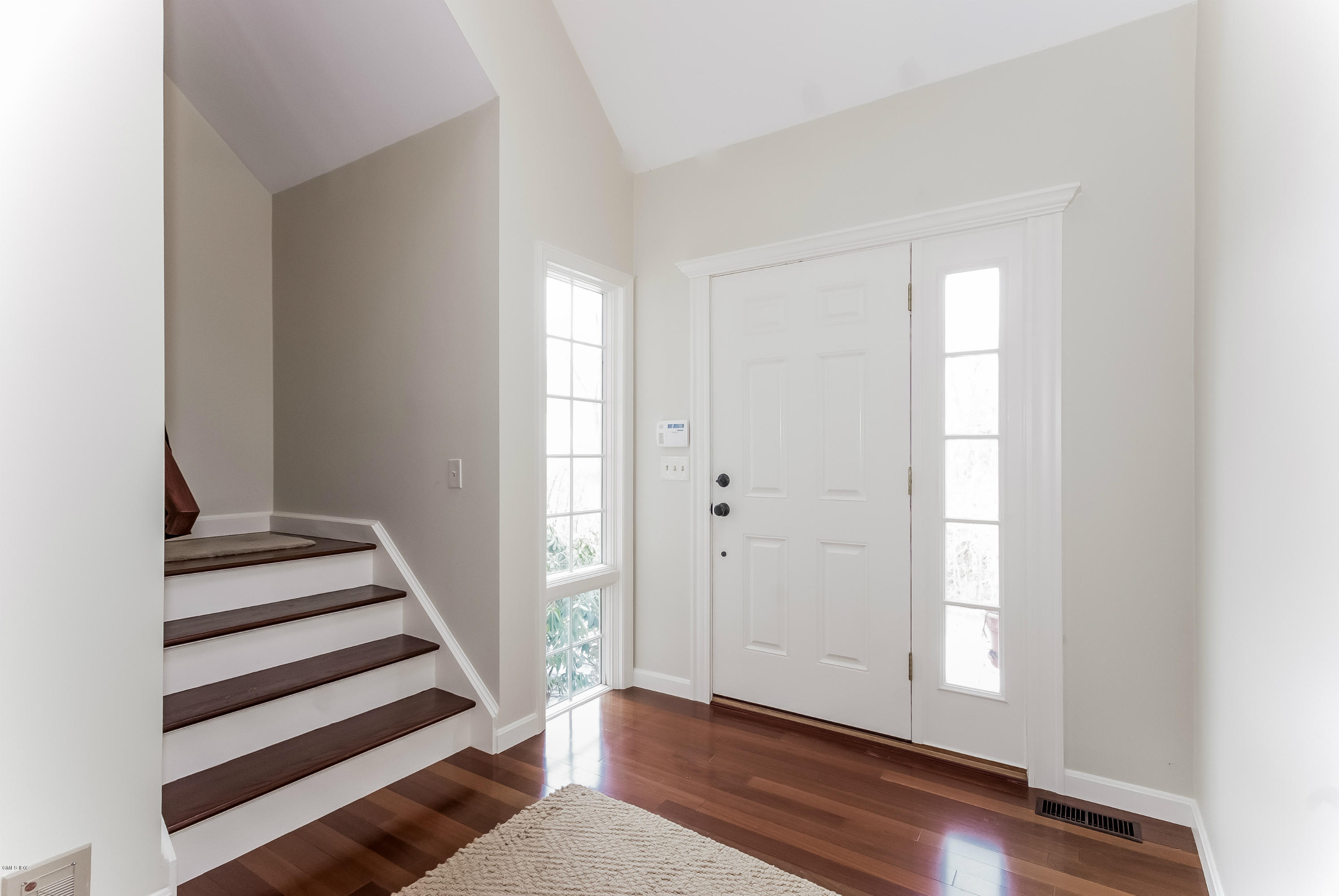 21 Roberta Lane Greenwich, CT 06830 - Photo 4 of 39 wooden floor in an empty room with a window