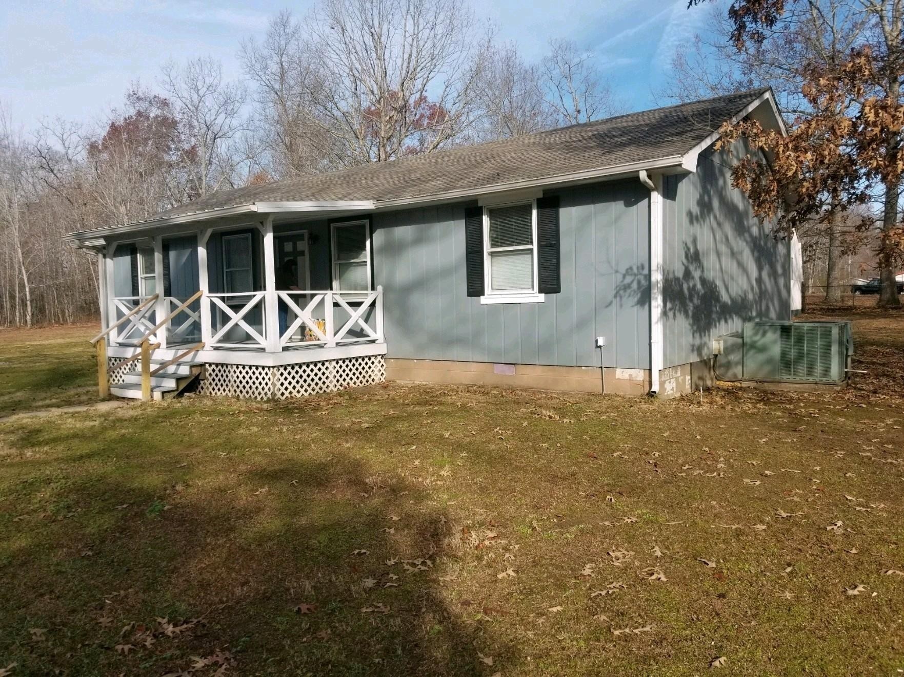 a front view of house with outdoor seating