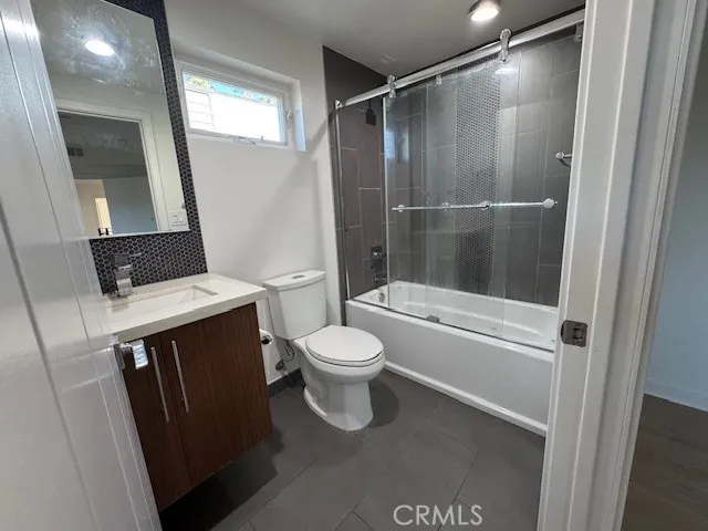a bathroom with a toilet a sink and a bathtub