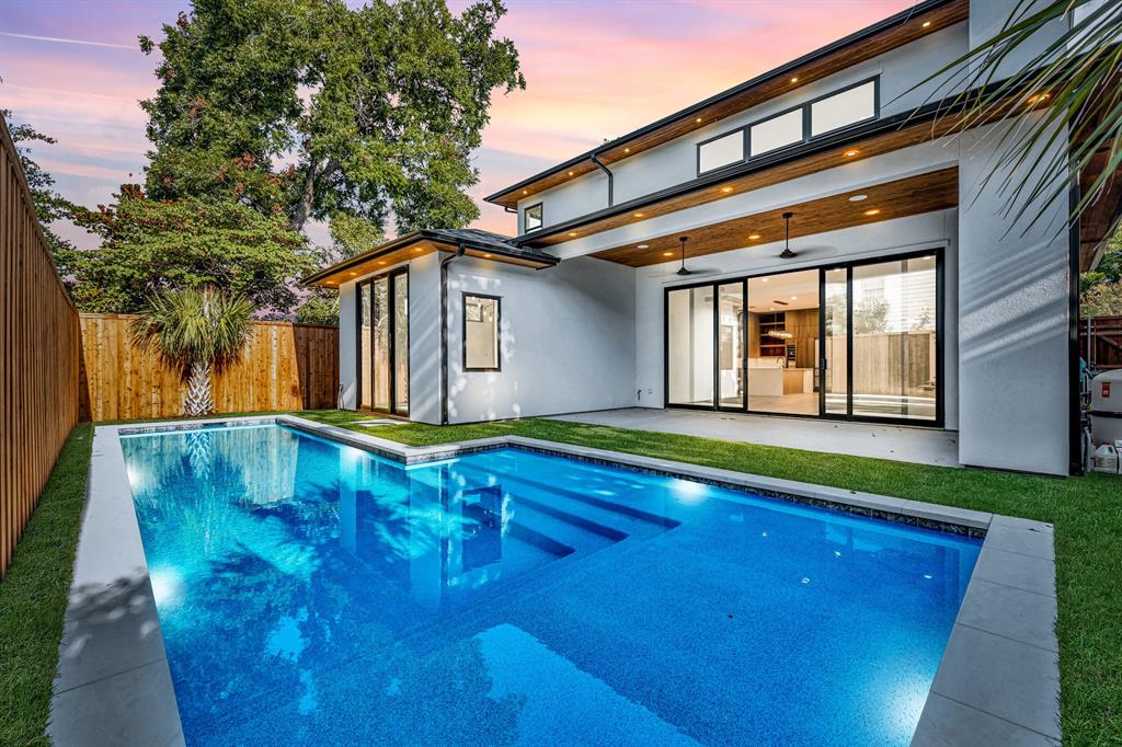 a front view of a house with swimming pool