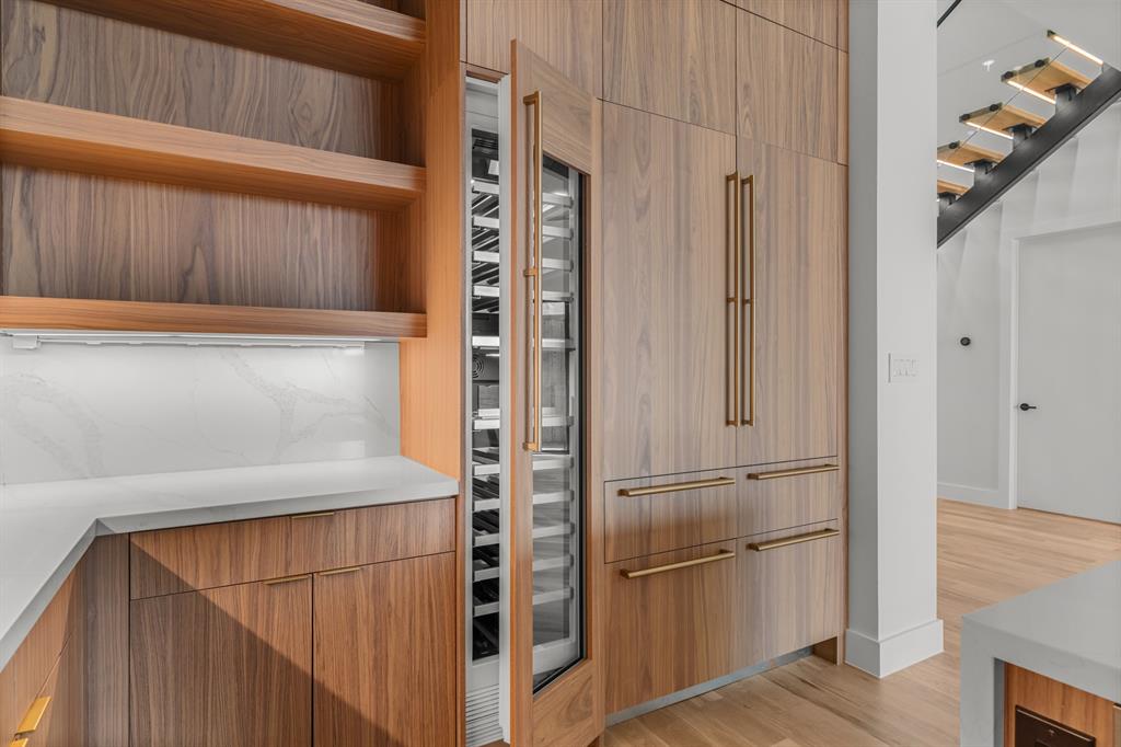 6231 McCommas Boulevard Dallas, TX 75214 - Photo 12 of 40 a kitchen with stainless steel appliances a refrigerator and a stove top oven