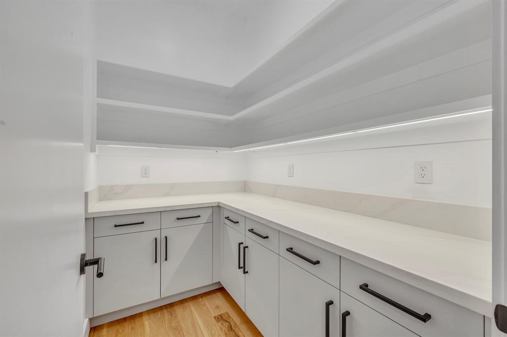6231 McCommas Boulevard Dallas, TX 75214 - Photo 17 of 40 a view of a kitchen with white cabinets