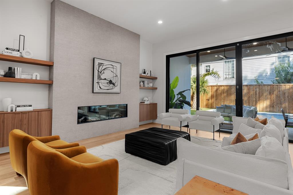 6231 McCommas Boulevard Dallas, TX 75214 - Photo 2 of 40 a living room with furniture ceiling fan and a large window