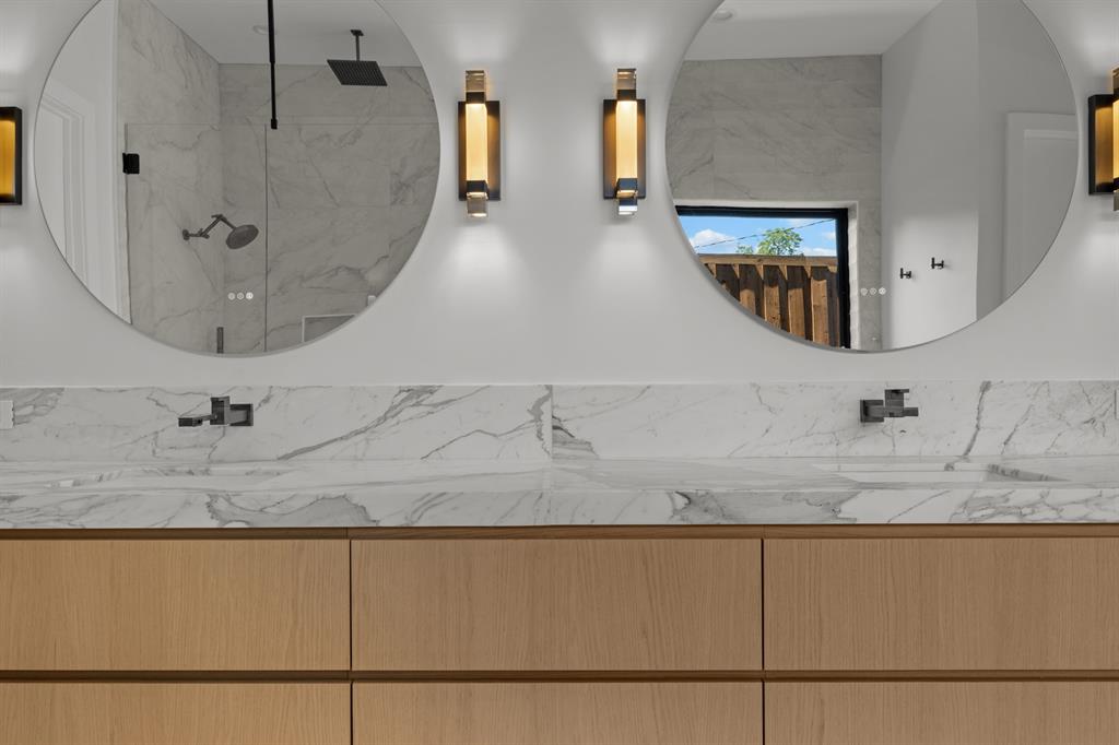 6231 McCommas Boulevard Dallas, TX 75214 - Photo 23 of 40 a bathroom with a sink and mirror