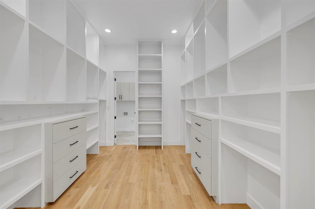 6231 McCommas Boulevard Dallas, TX 75214 - Photo 26 of 40 a view of walk in closet with empty racks