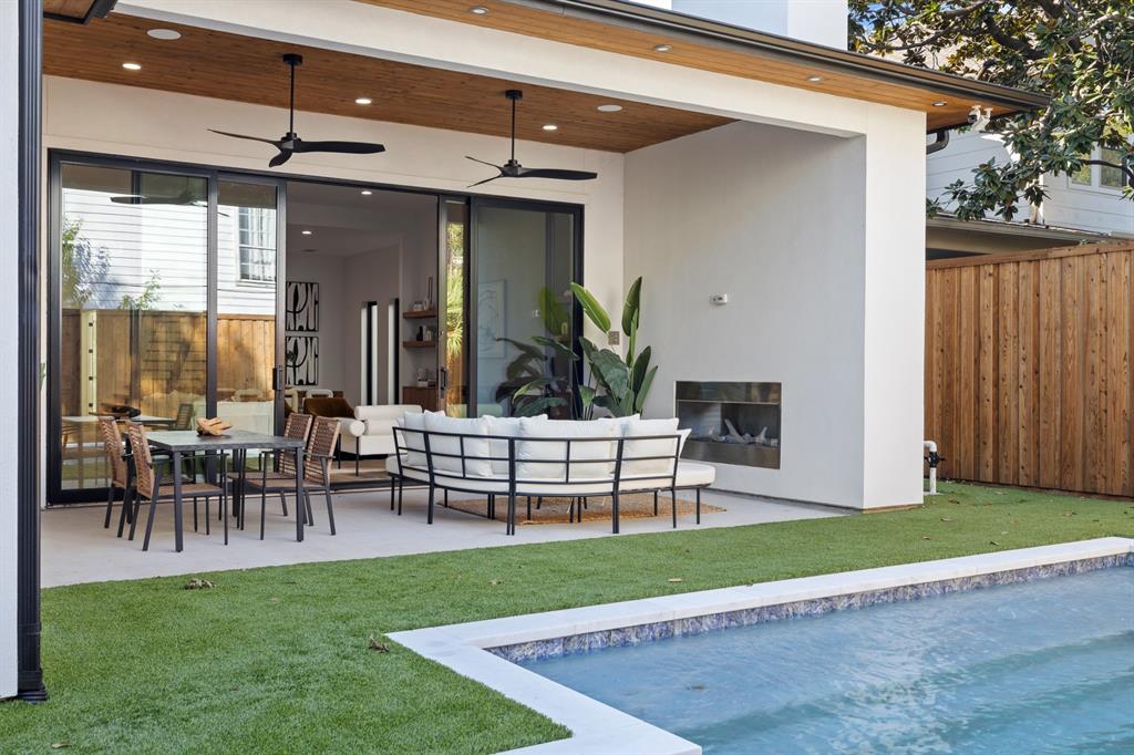 6231 McCommas Boulevard Dallas, TX 75214 - Photo 4 of 40 a view of a patio with table and chairs potted plants and large tree