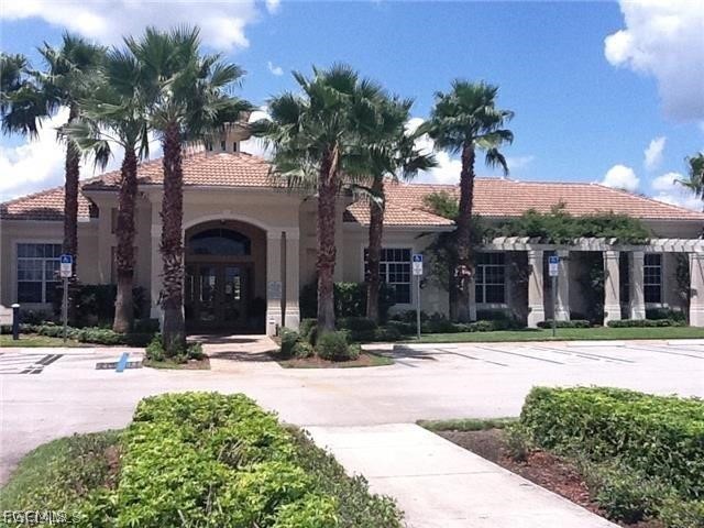 8554 Athena Court Lehigh Acres, FL 33971 - Photo 14 of 22 a view of a house with palm trees