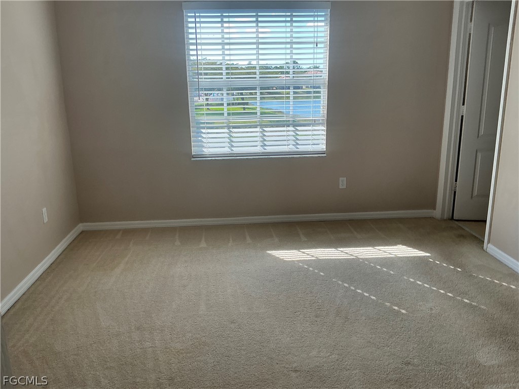 8554 Athena Court Lehigh Acres, FL 33971 - Photo 5 of 22 an empty room with a window