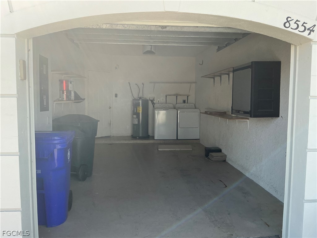8554 Athena Court Lehigh Acres, FL 33971 - Photo 9 of 22 a view of a storage & utility room with washer and dryer