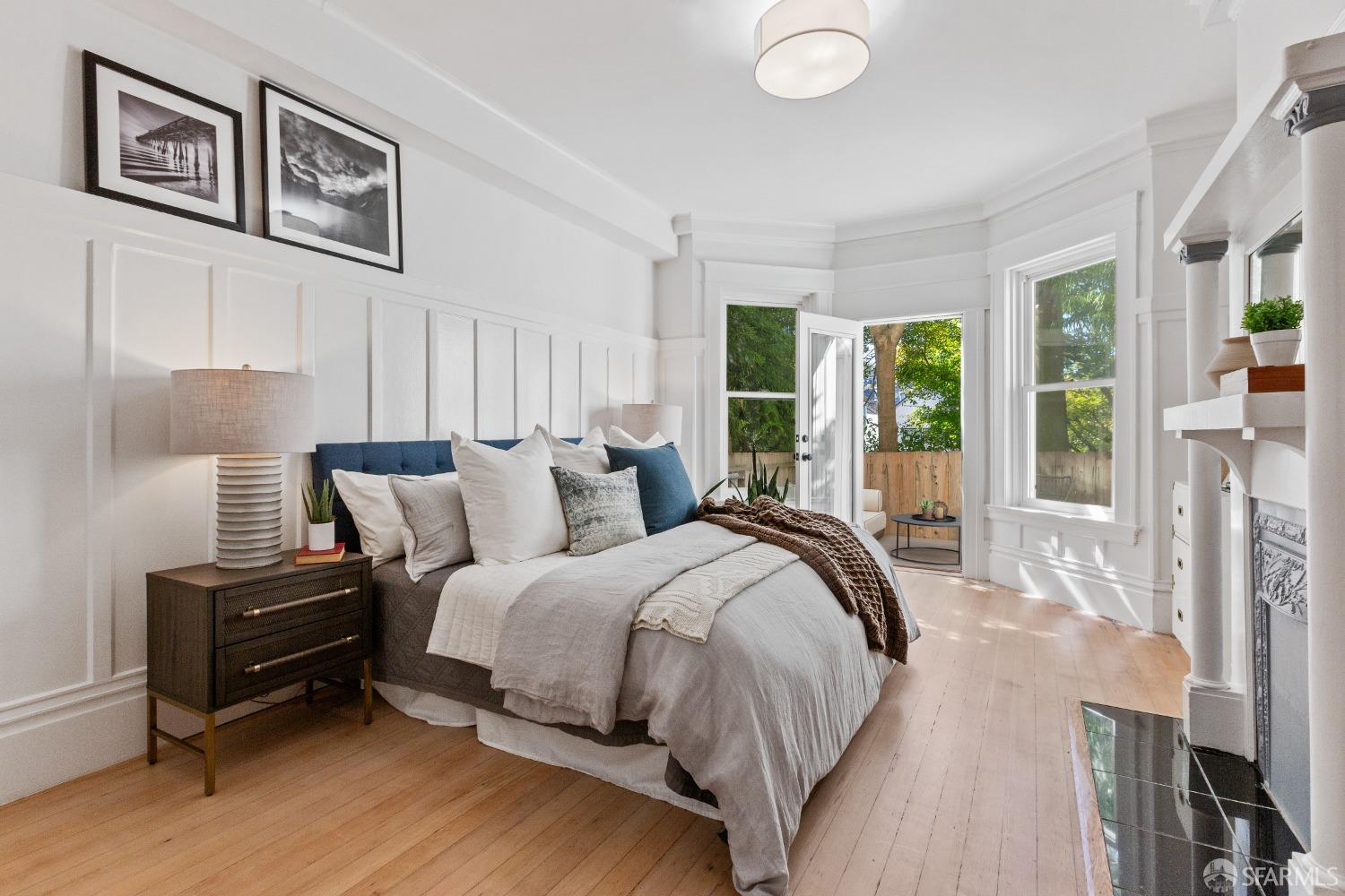 931 Clayton Street San Francisco, CA 94117 - Photo 20 of 28 a bedroom with bed and a large window