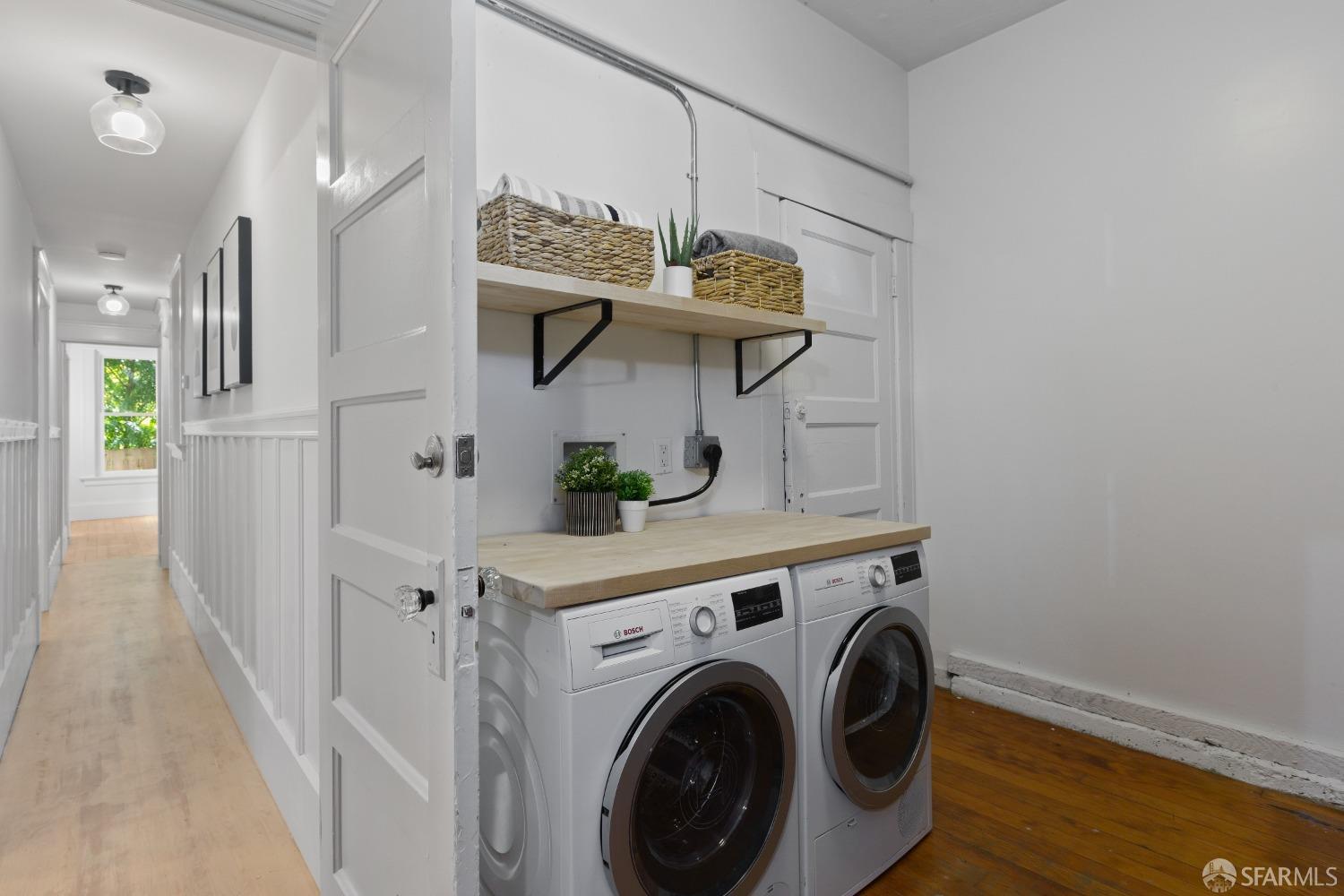 931 Clayton Street San Francisco, CA 94117 - Photo 26 of 28 a view of storage and utility room with washer and dryer