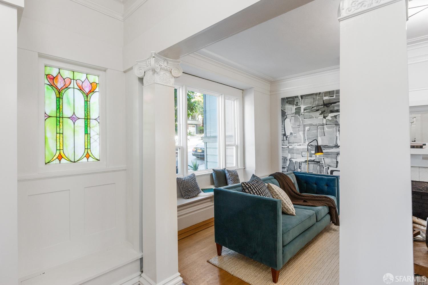 931 Clayton Street San Francisco, CA 94117 - Photo 4 of 28 a living room with furniture and a large window