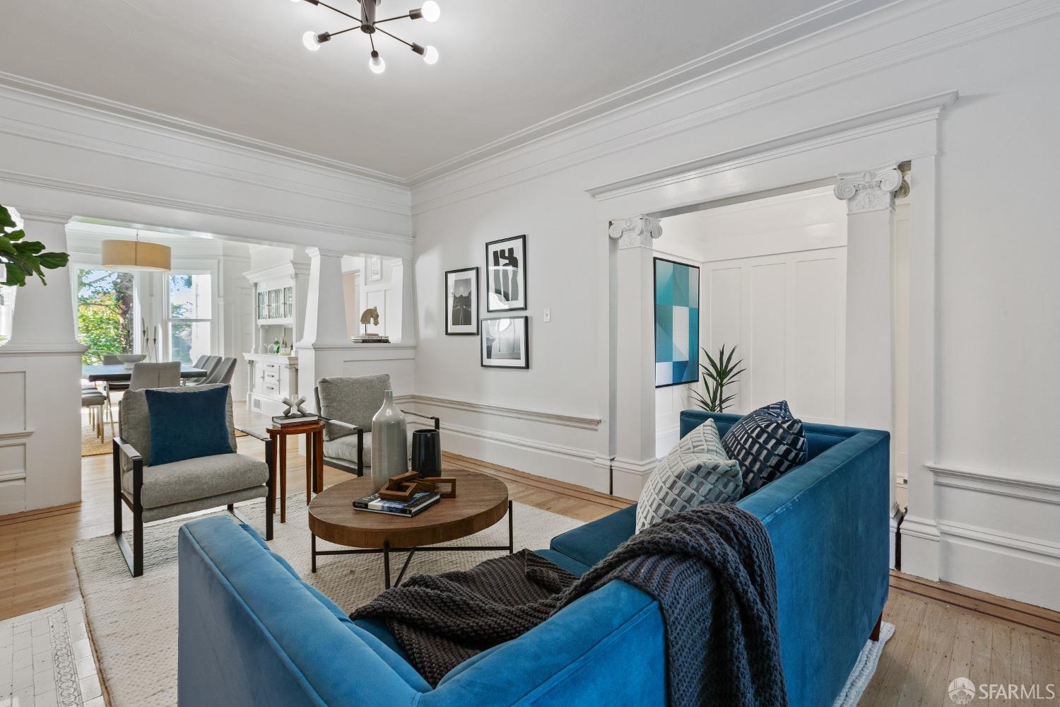 931 Clayton Street San Francisco, CA 94117 - Photo 6 of 28 a living room with furniture and a potted plant
