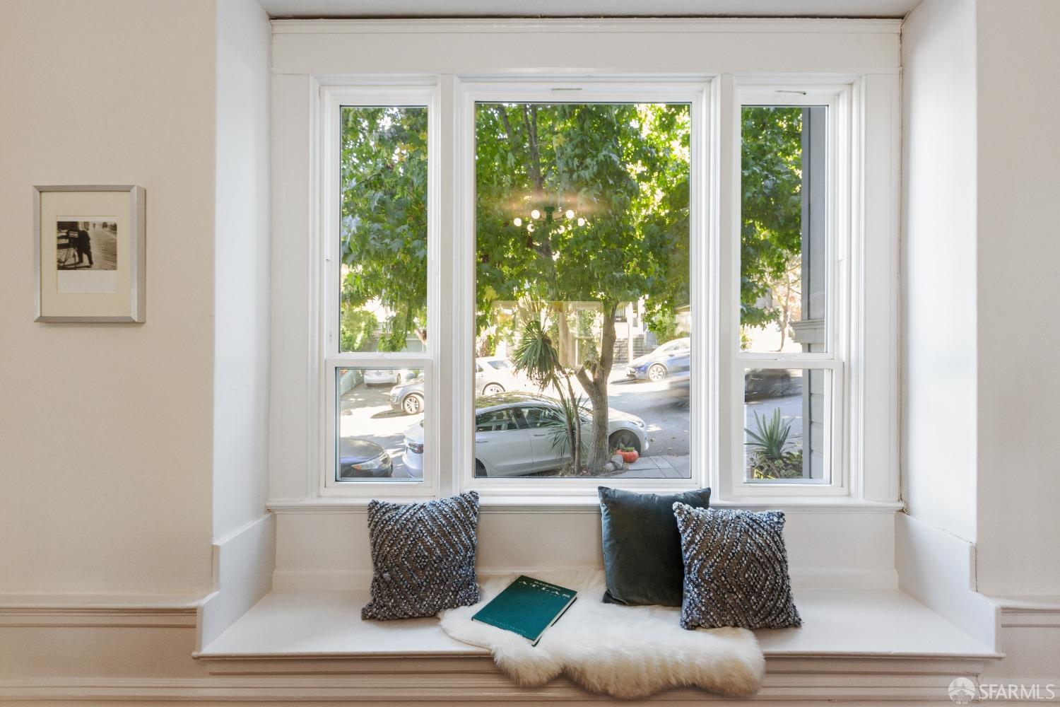 931 Clayton Street San Francisco, CA 94117 - Photo 7 of 28 a living room with furniture and a window