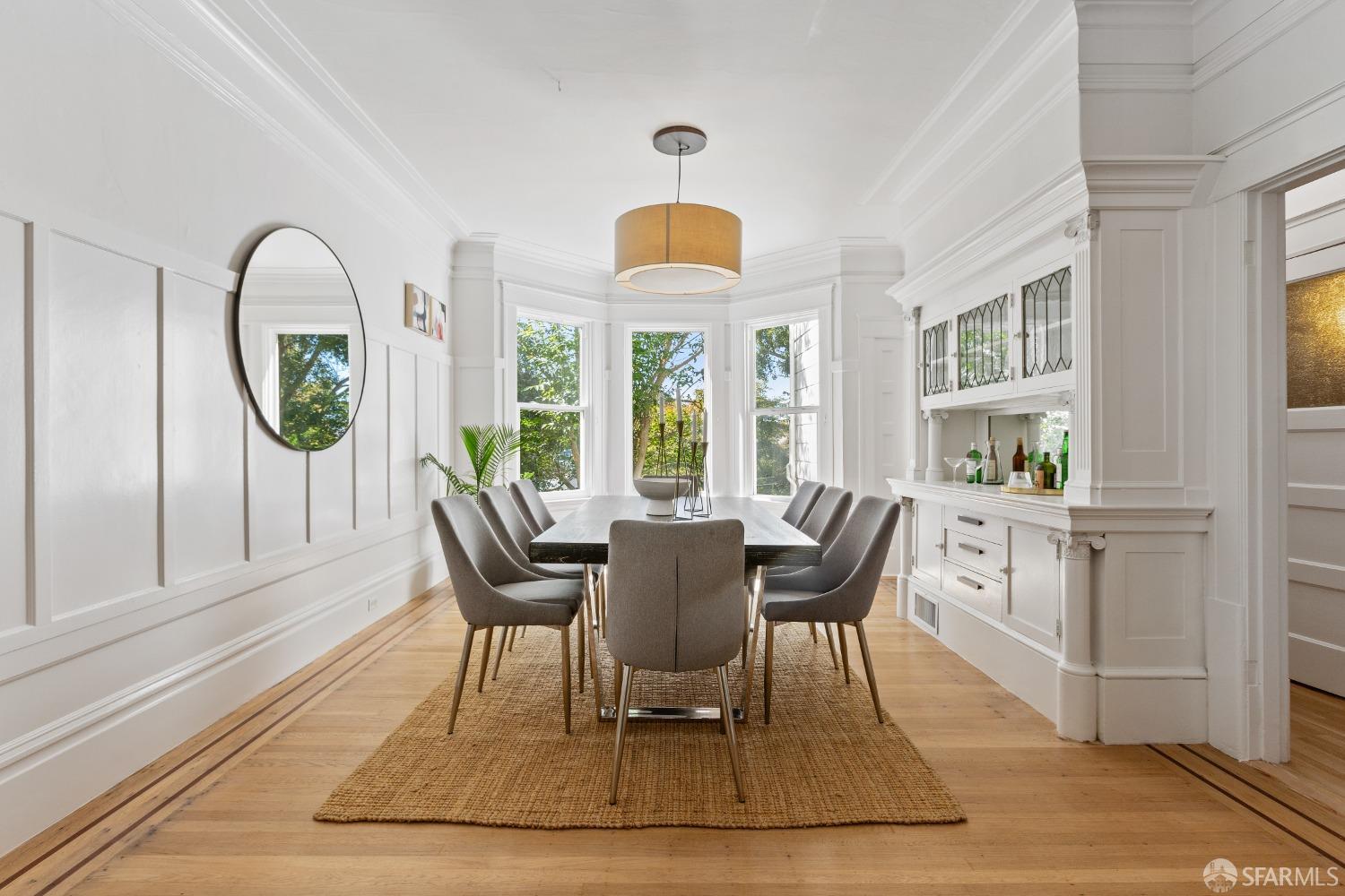 931 Clayton Street San Francisco, CA 94117 - Photo 9 of 28 a view of a dining room with furniture window and wooden floor