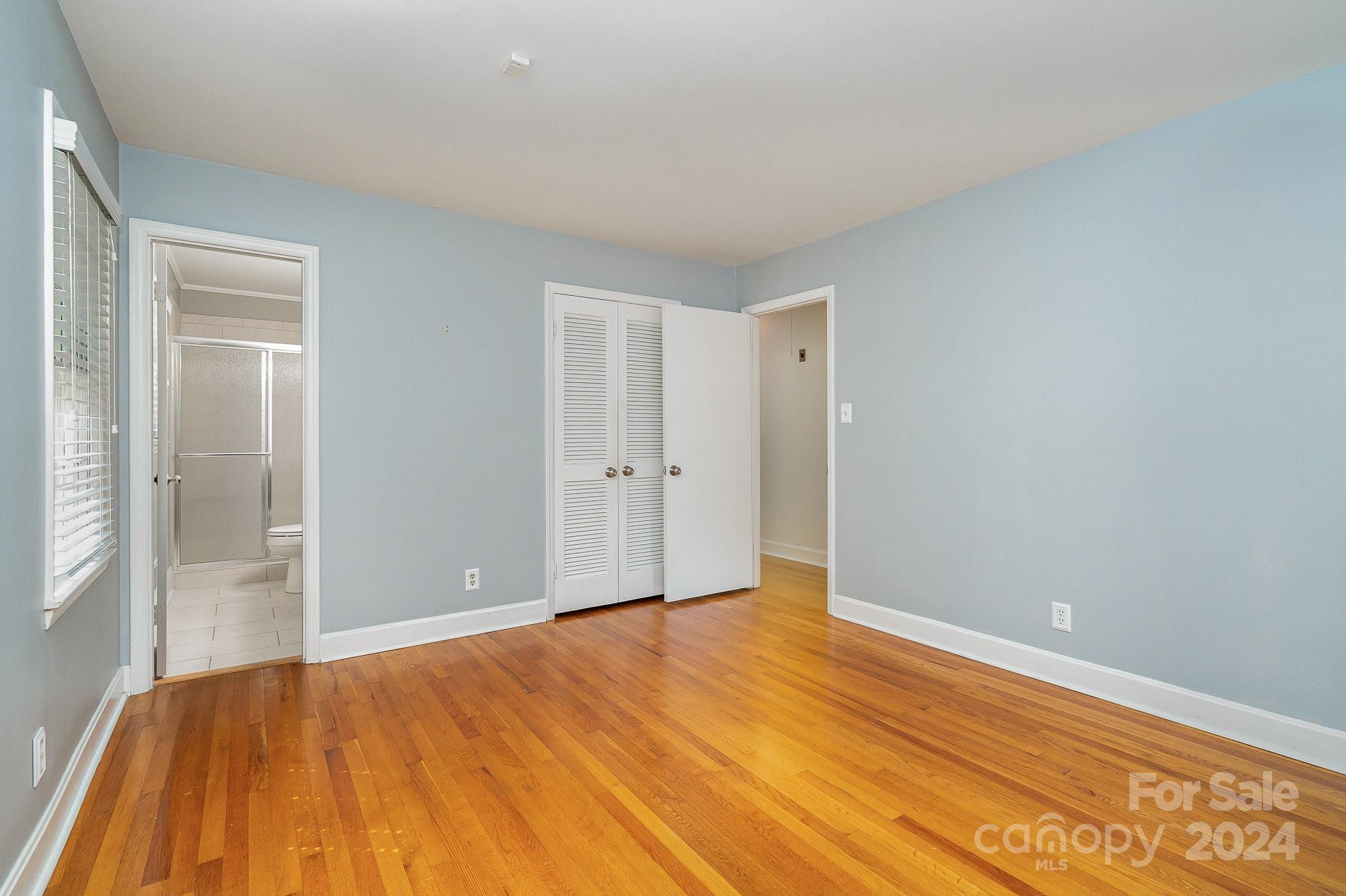 6529 Idlebrook Drive Charlotte, NC 28212 - Photo 11 of 28 a view of empty room with wooden floor