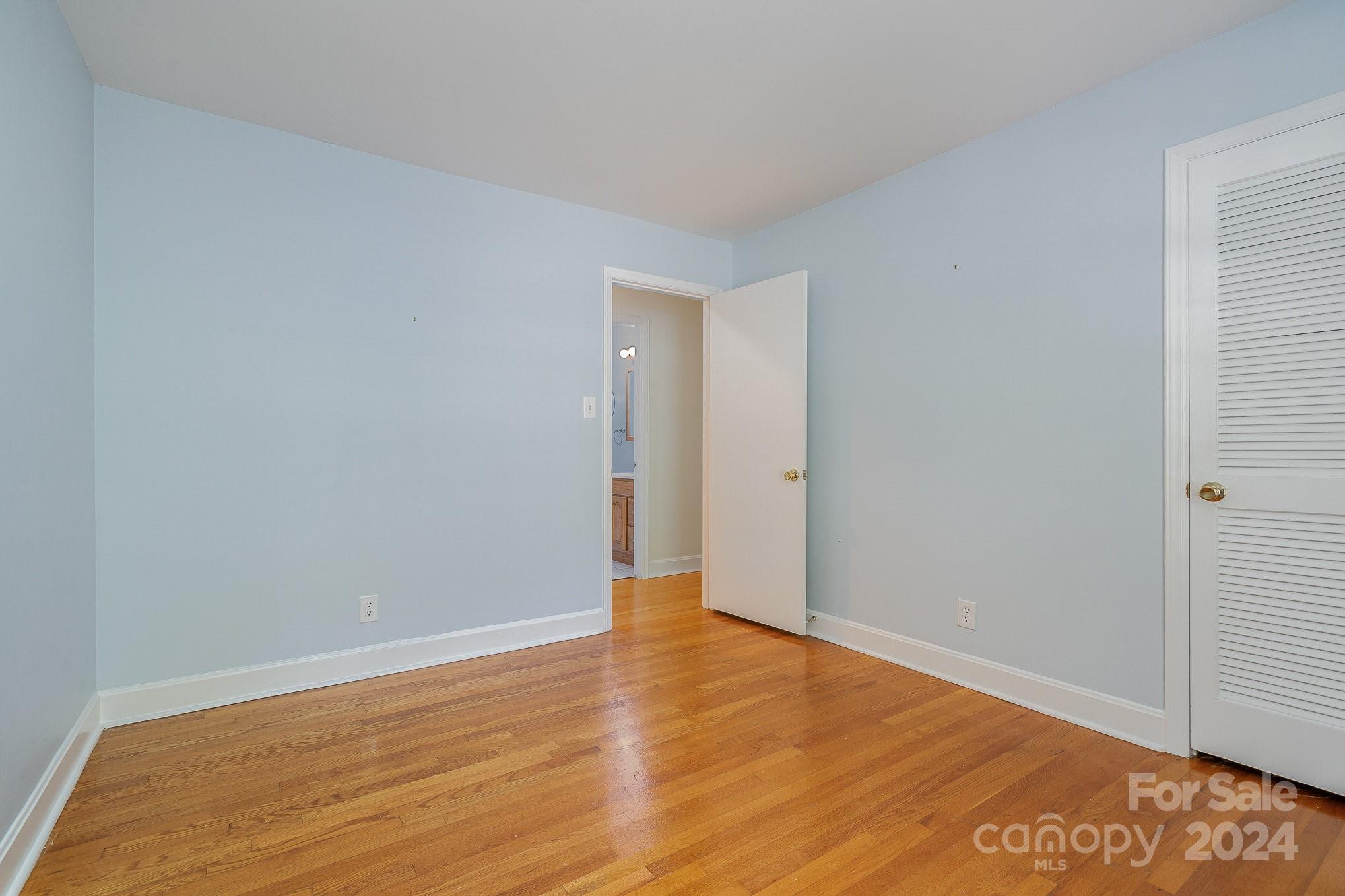6529 Idlebrook Drive Charlotte, NC 28212 - Photo 27 of 28 a view of an empty room with wooden floor