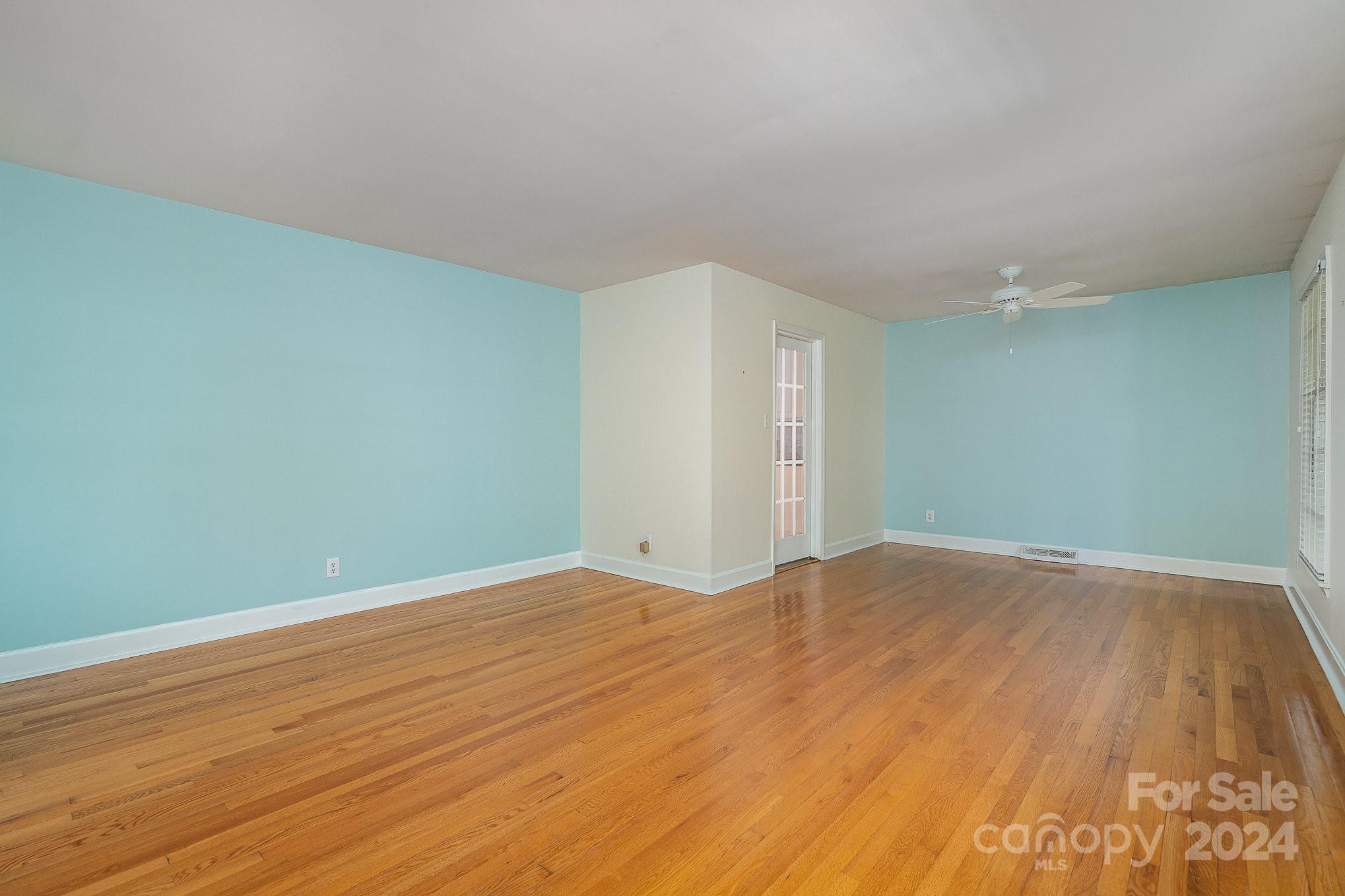 6529 Idlebrook Drive Charlotte, NC 28212 - Photo 9 of 28 a view of an empty room with wooden floor
