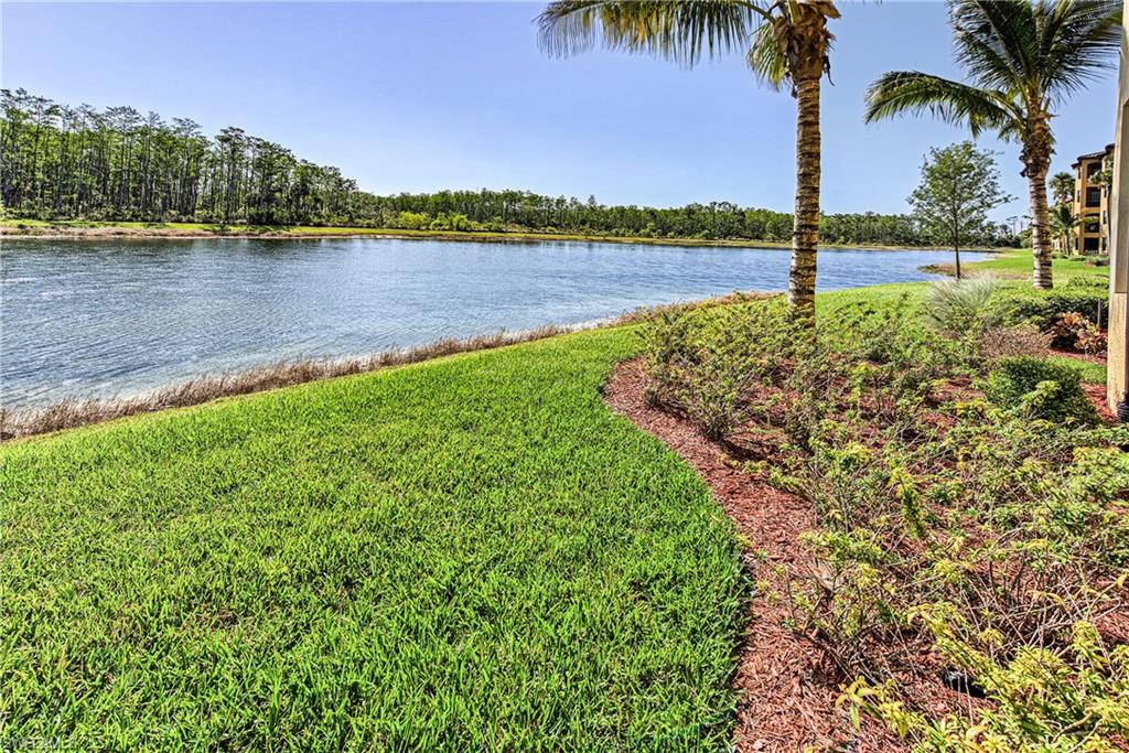 9572 Trevi Court, Unit 5015 Naples, FL 34113 - Photo 18 of 39 a view of a lake and a beach