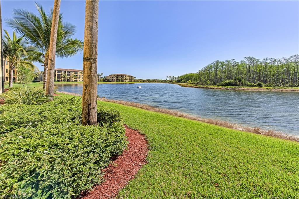 9572 Trevi Court, Unit 5015 Naples, FL 34113 - Photo 19 of 39 a view of a lake with a big yard
