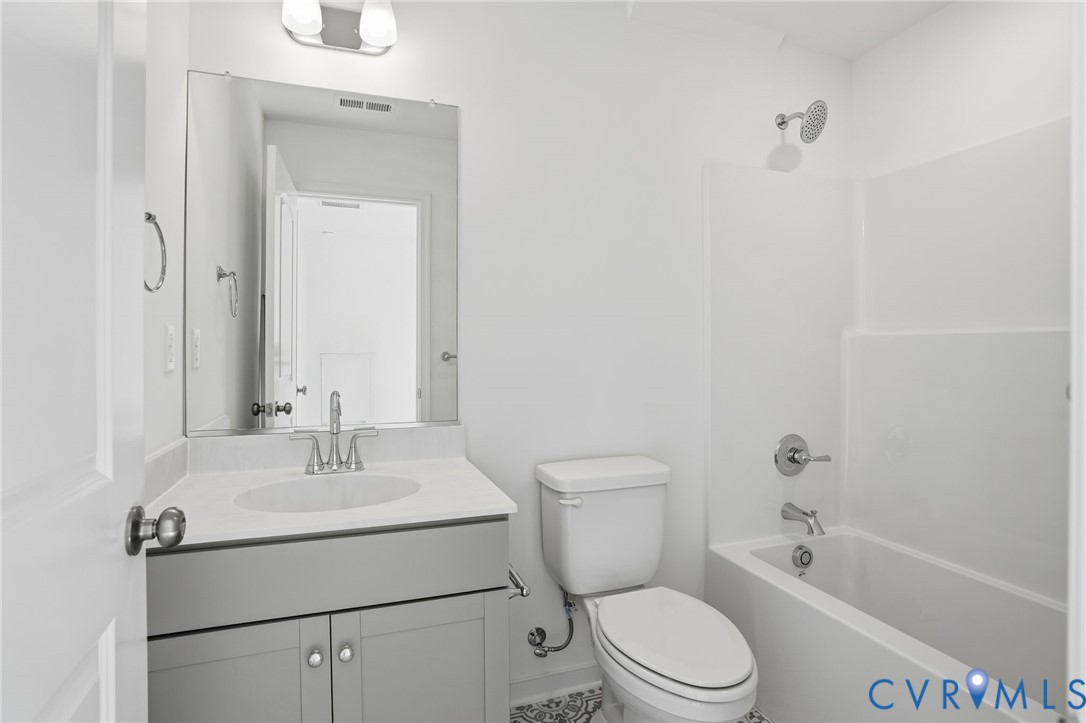 9991 Boschen Wds Place Chesterfield, VA 23832 - Photo 22 of 38 a bathroom with a sink a toilet and shower