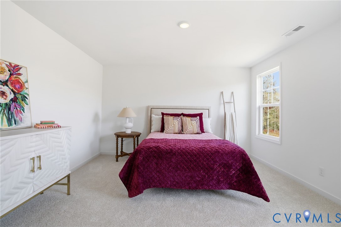 9991 Boschen Wds Place Chesterfield, VA 23832 - Photo 23 of 38 a bedroom with a bed and a window