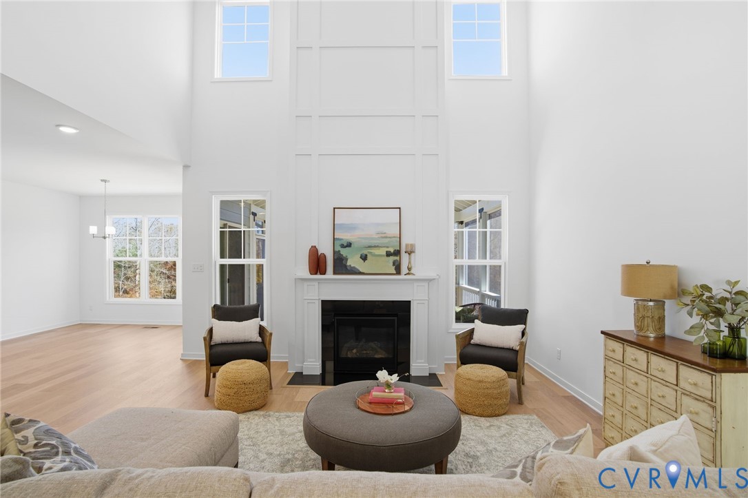 9991 Boschen Wds Place Chesterfield, VA 23832 - Photo 3 of 38 a living room with furniture a fireplace and a window