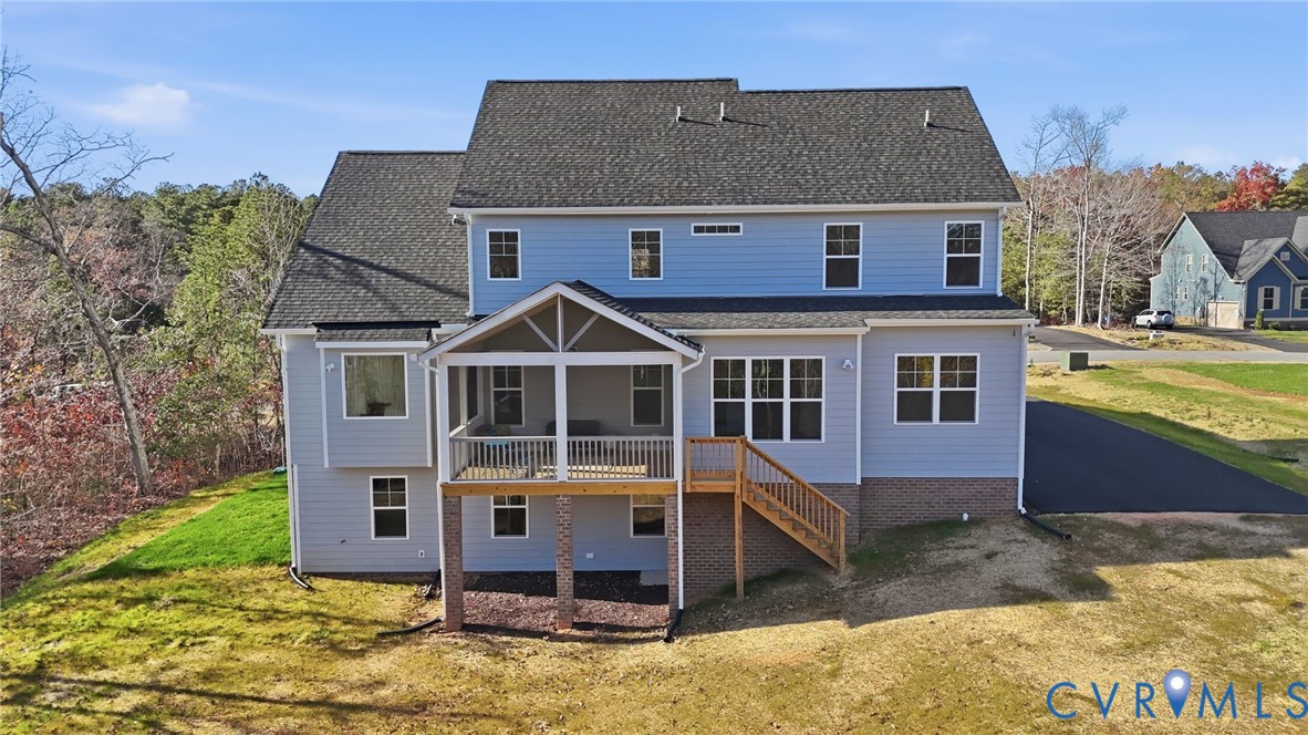 9991 Boschen Wds Place Chesterfield, VA 23832 - Photo 35 of 38 a front view of a house with a yard