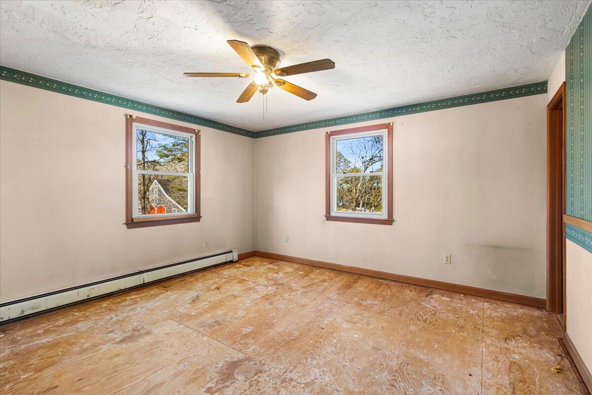 1094 County Road Cataumet, MA 02534 - Photo 21 of 42 a view of an empty room with a window