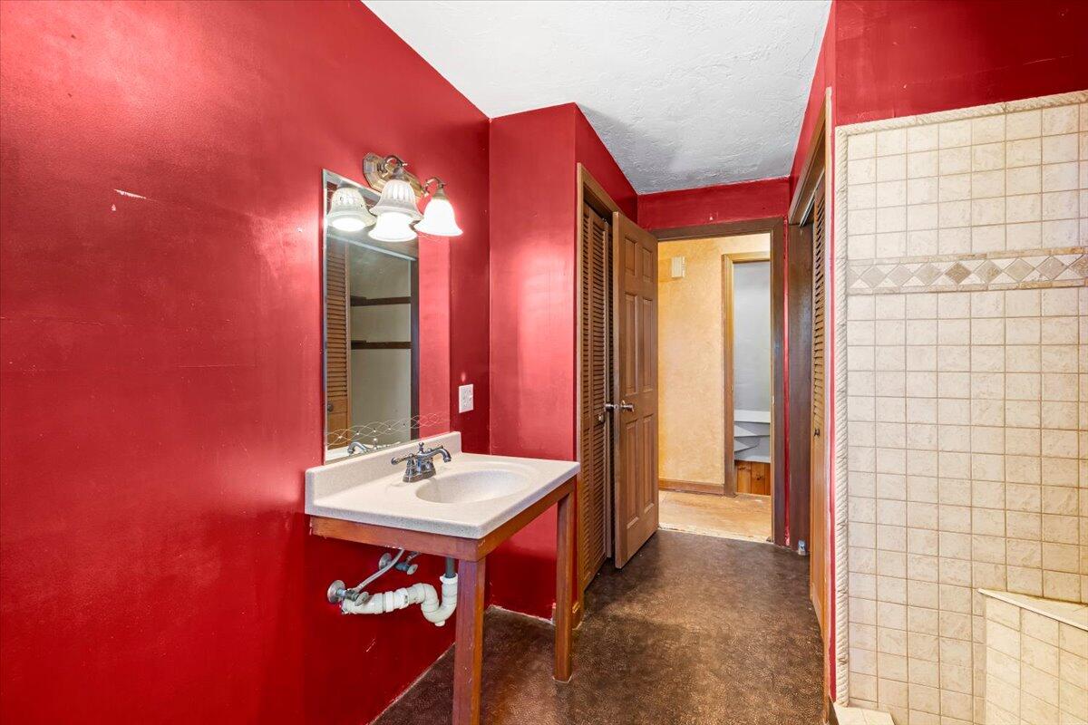 1094 County Road Cataumet, MA 02534 - Photo 24 of 42 a bathroom with a sink and a mirror