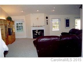201 Sean Way Hendersonville, NC 28792 - Photo 2 of 8 a living room with furniture and a fireplace