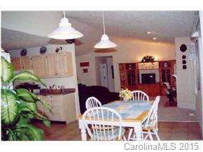 201 Sean Way Hendersonville, NC 28792 - Photo 5 of 8 a dining room with furniture and a chandelier