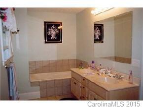 201 Sean Way Hendersonville, NC 28792 - Photo 7 of 8 a bathroom with a sink mirror and a bath tub