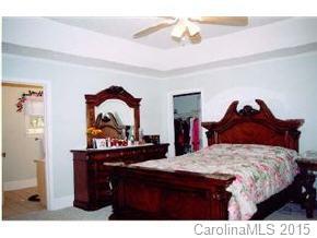 201 Sean Way Hendersonville, NC 28792 - Photo 8 of 8 a bedroom with a bed and a dresser