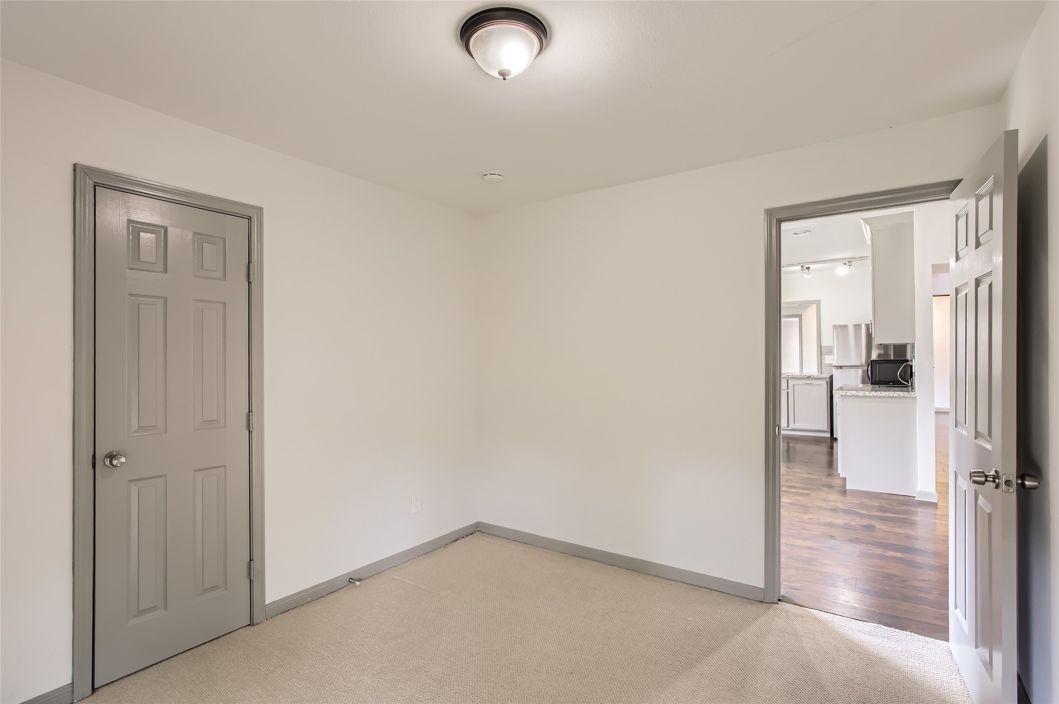 6509 Birdwood Road Houston, TX 77074 - Photo 21 of 26 an empty room that has a wooden cupboard