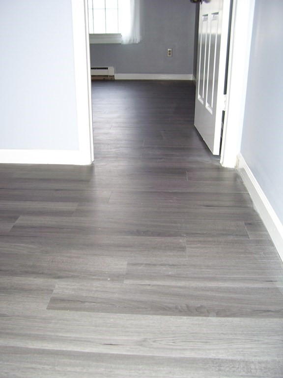 4 Balcomb Street, Unit 4 Salem, MA 01970 - Photo 19 of 38 a view of a hallway with wooden floor
