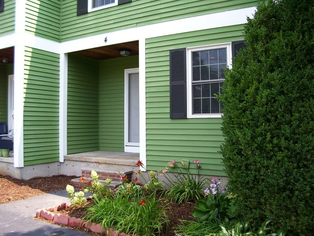 4 Balcomb Street, Unit 4 Salem, MA 01970 - Photo 2 of 38 a front view of a house with plants